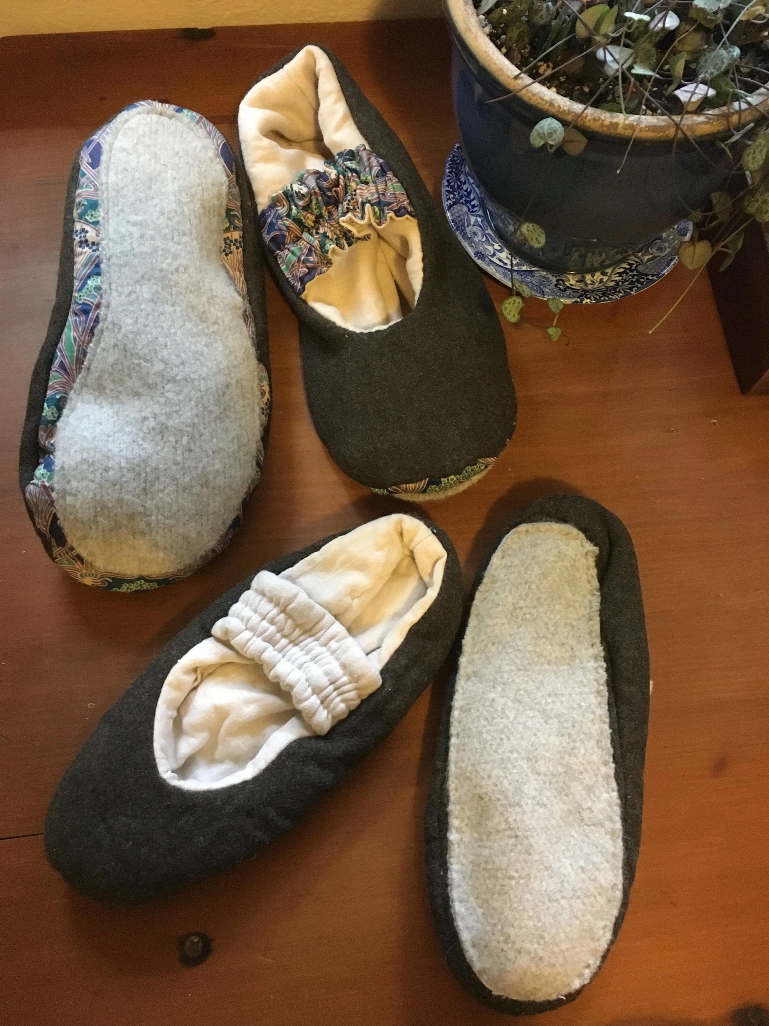Underside of house slippers made from a shrunk grey baby's cashmere jumper (received as a gift), vintage linen dress and liberty fabric