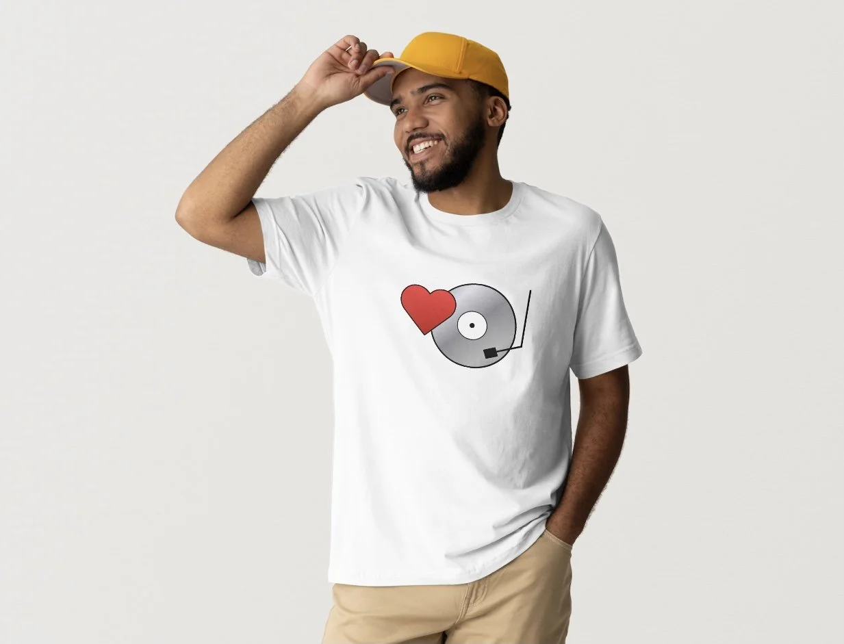 Man wearing White T-shirt with Red Heart Overlapping Gray Vinyl Record that is Love On Vinyl Logo
