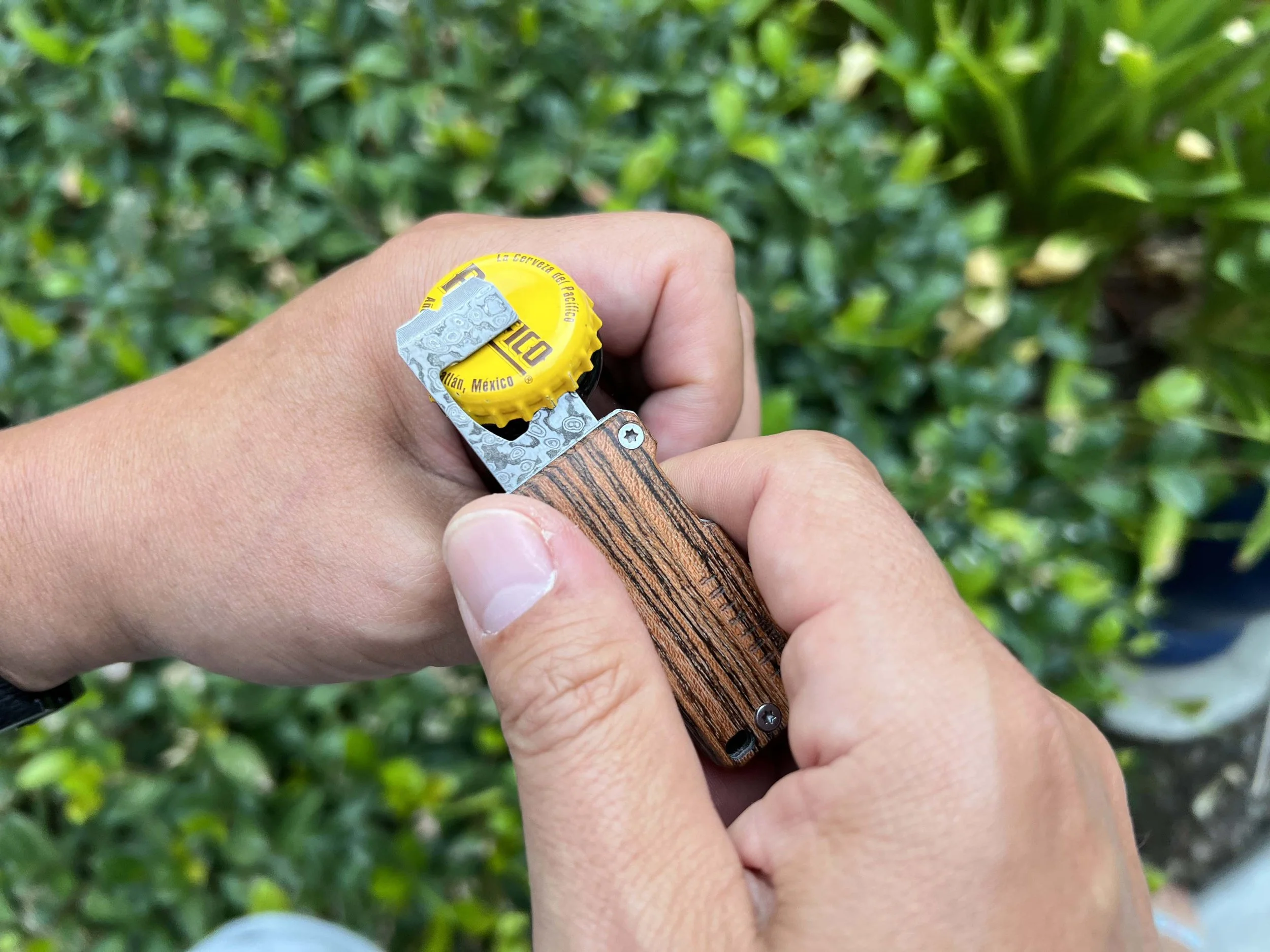 Edge & Pop bottle opener opening a beer
