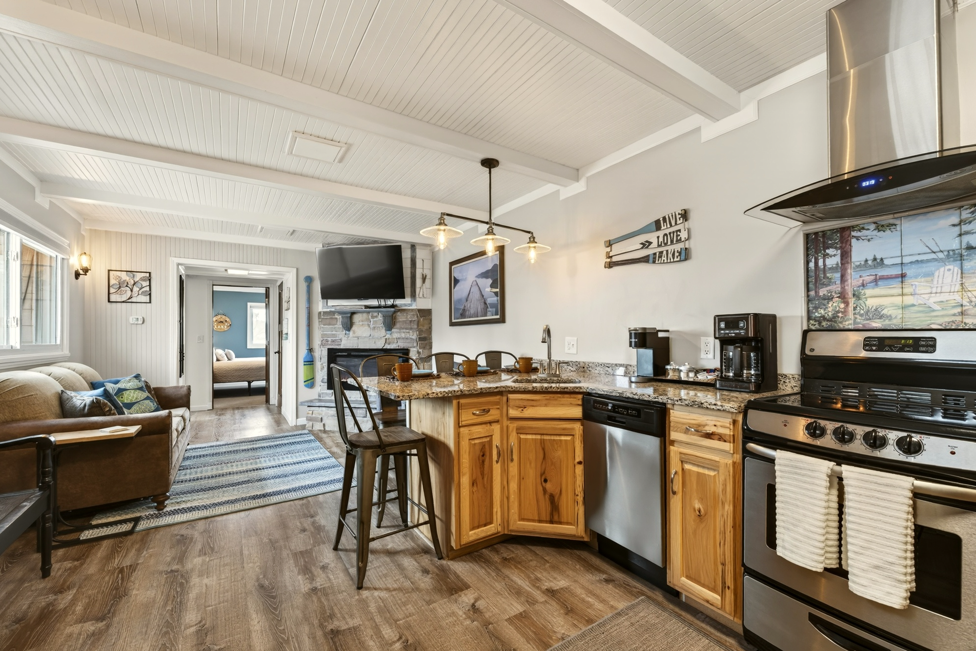 Two-bedroom hotel suite with full kitchen and private deck in Minocqua, WI