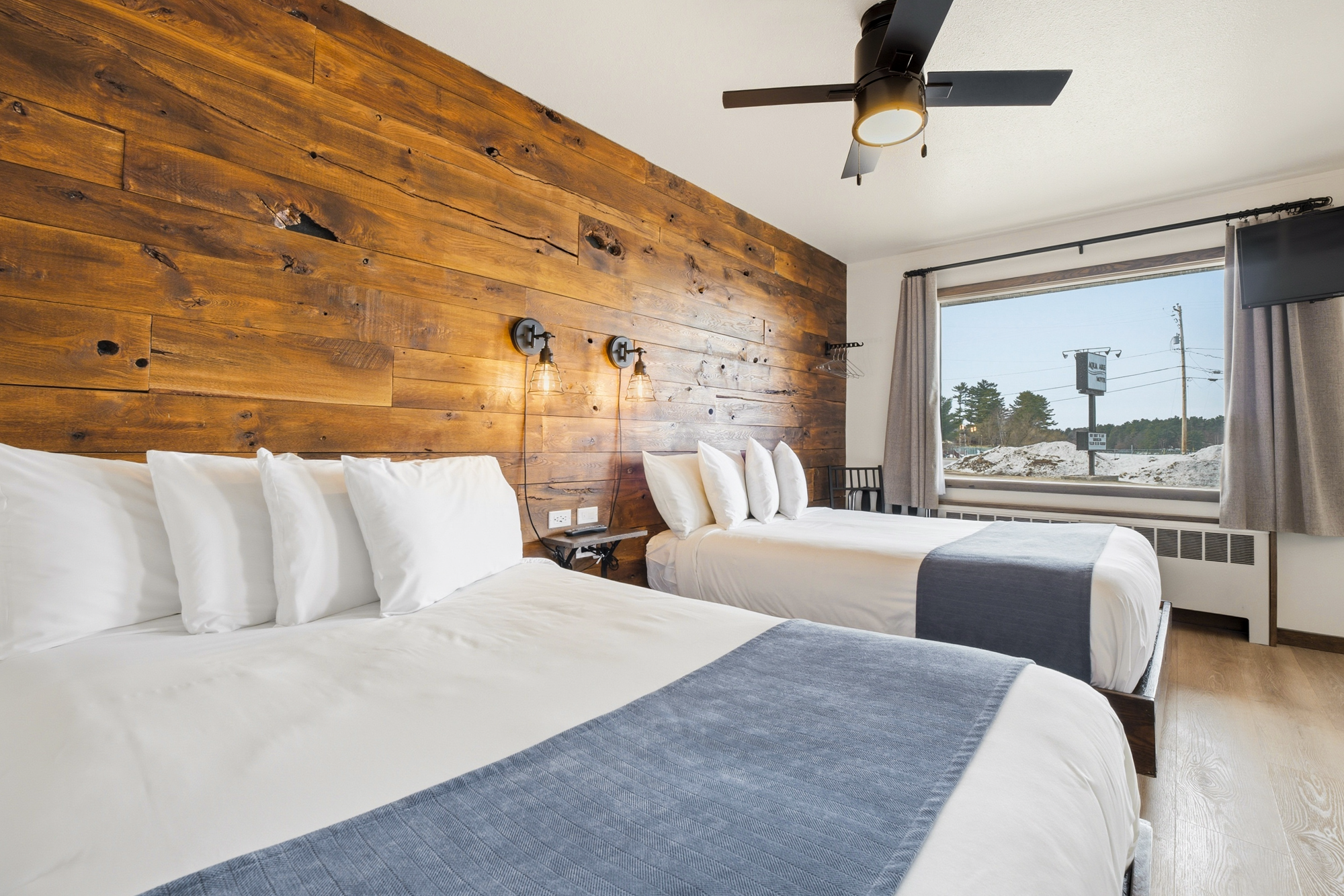 Hotel room with two double beds in Minocqua, WI — Aqua Aire Inn & Suites
