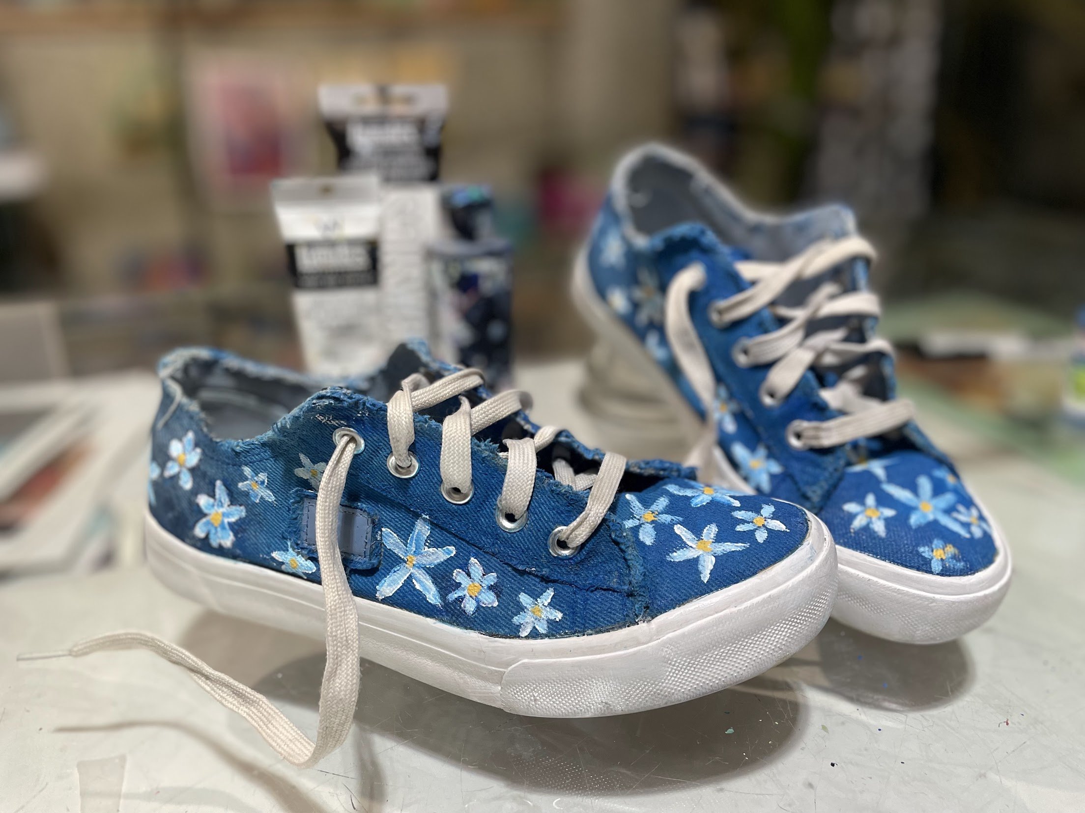 Natalie's handpainted daisy sneakers.jpg