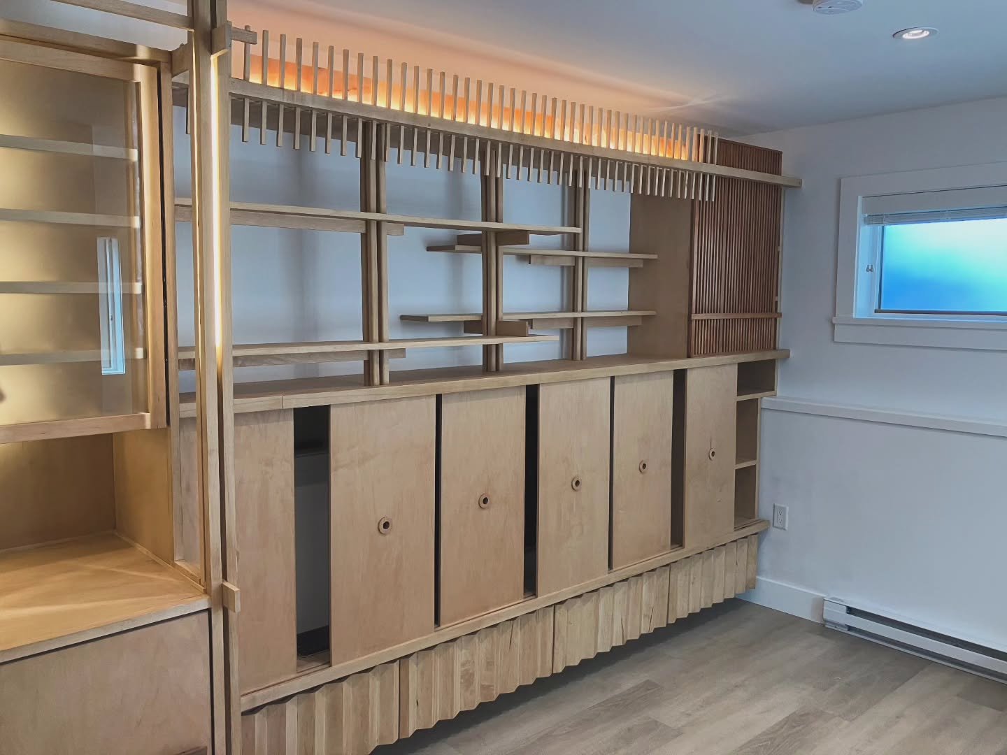 Beautiful japandy built-in cabinet.  Constructed in collaboration with and designed by Kingfisher Carpentry.  Built from hard maple by hand.  Wine rack and fridge,  lots of hidden storage, and a hidden media console, Make this a unique and incredibly