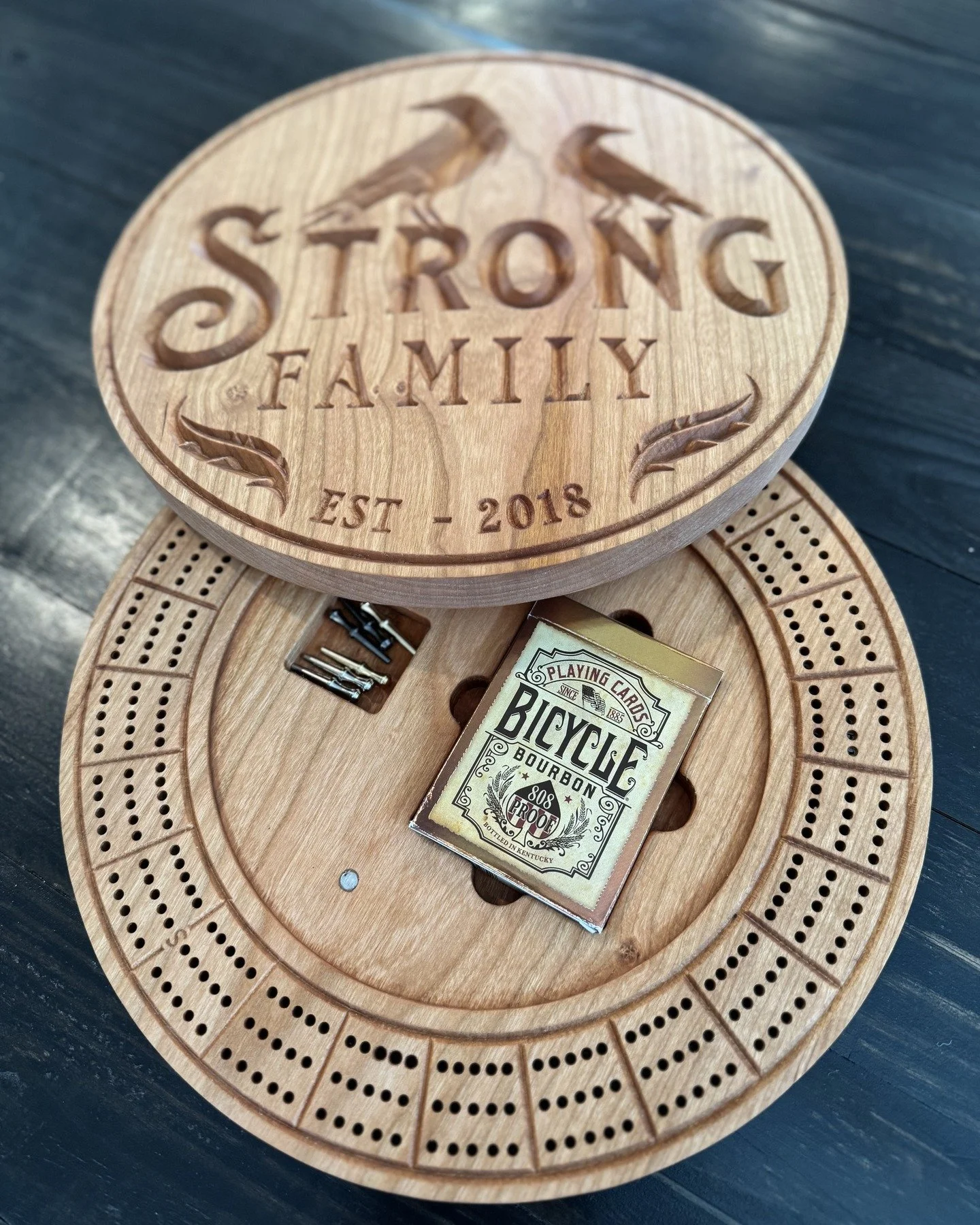 Custom crib board from solid cherry. 

Fully custom-engraved graphic with slots for cards and pegs on the inside. 

So happy with how it will turn out! Reach out if you would like a custom project like this!