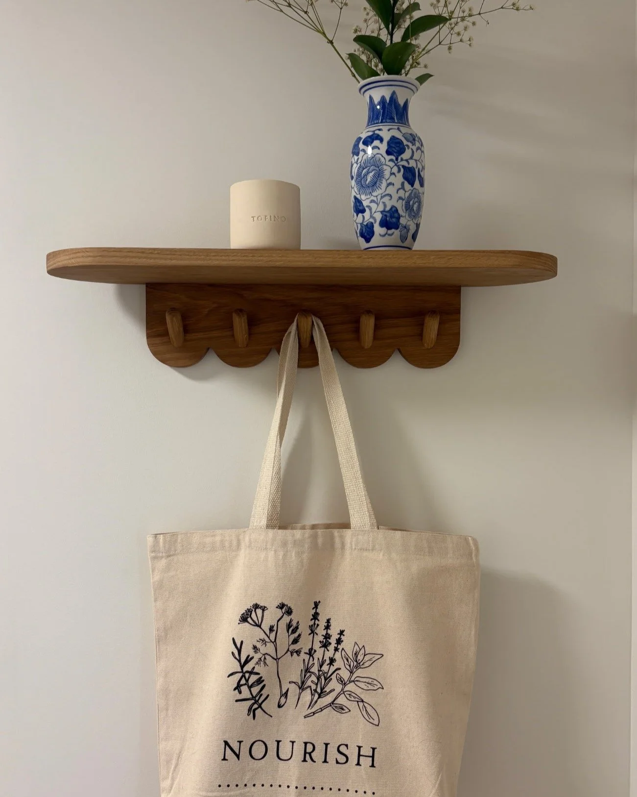 Beautiful Entry Way shelf commission. 

solid white oak. hand turned pegs.