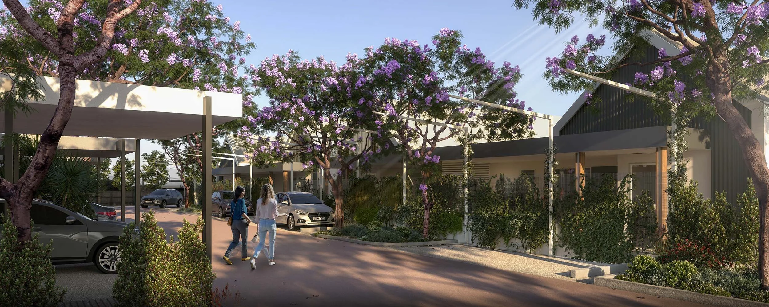 Tree-lined street with cars and people walking
