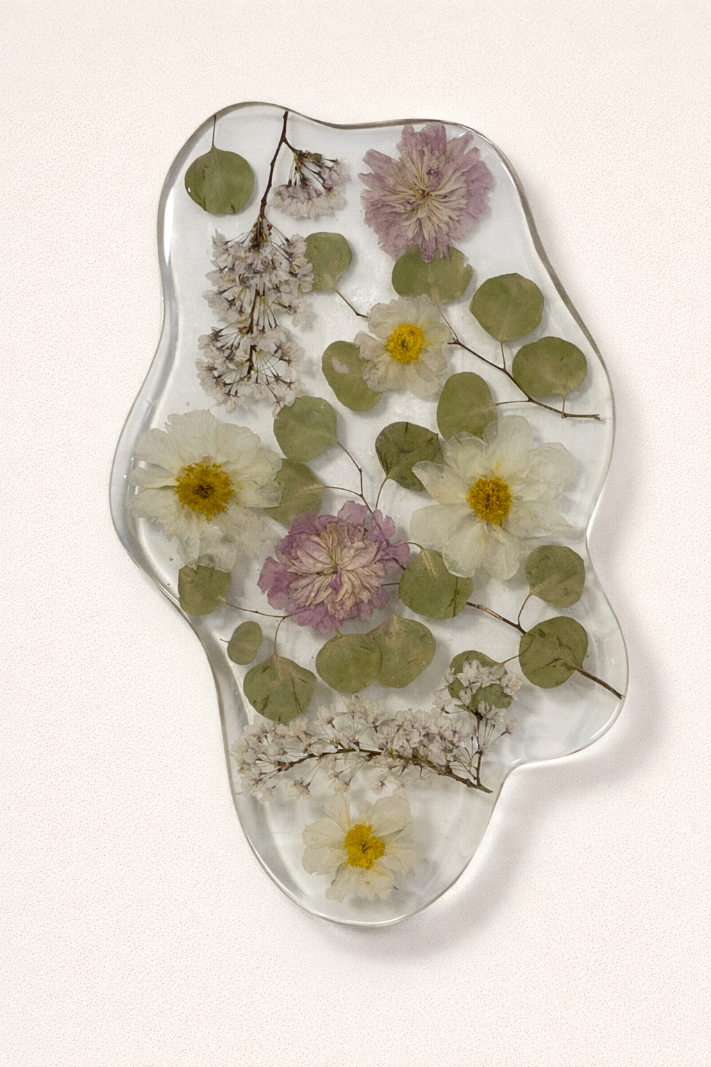 Decorative glass tray with pressed flowers and leaves