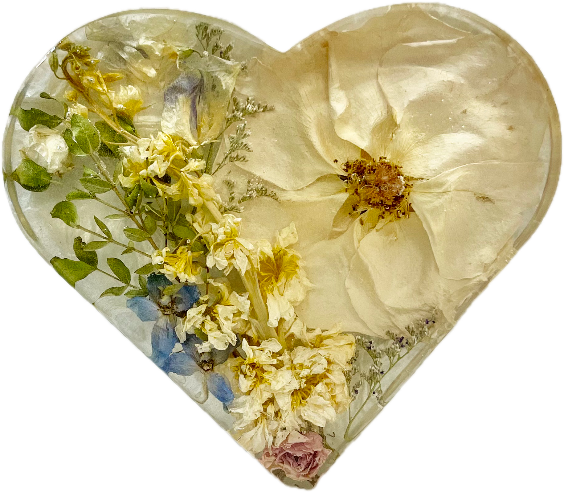 A heart-shaped container filled with dried white, yellow, blue, and pink flowers and leaves.