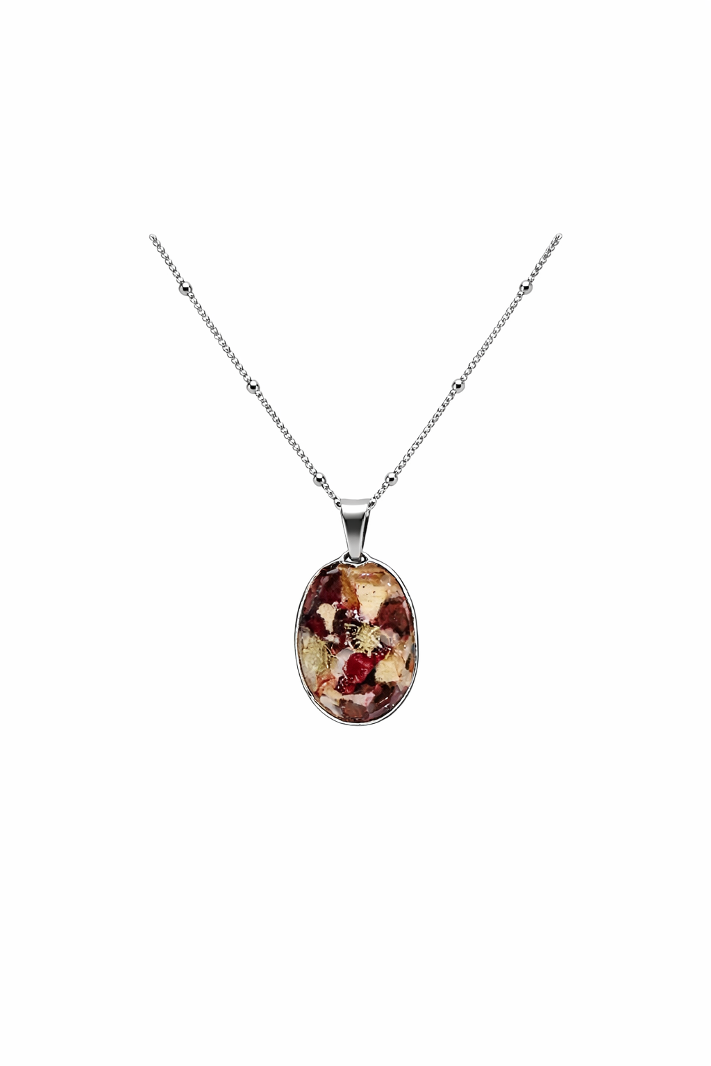 Silver necklace with an oval pendant containing red, gold, and beige decorative stones.