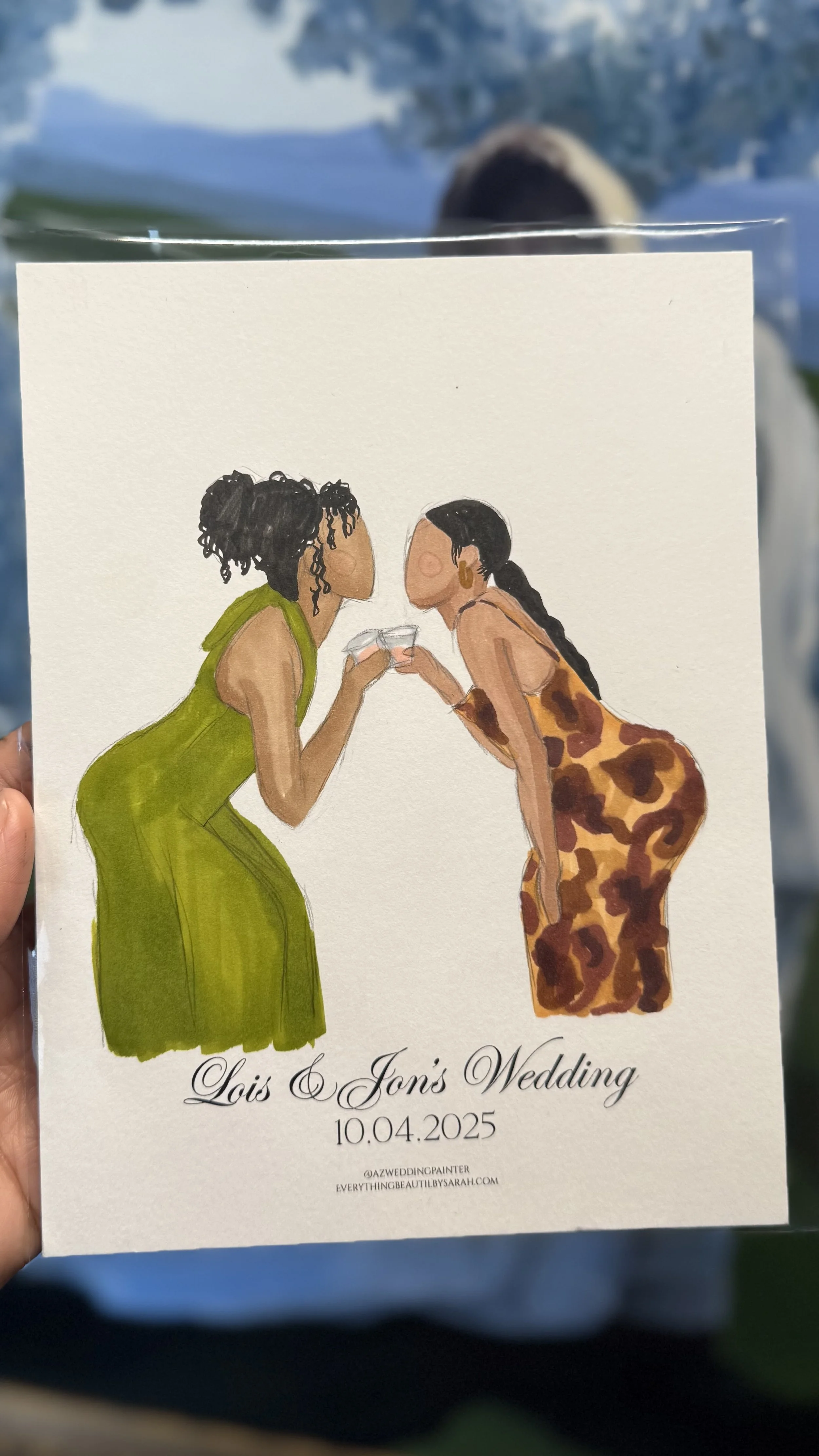 Illustration of two women clinking glasses at a wedding, one in a green dress with curly hair, the other in a leopard print dress with long black braids, with wedding details underneath.