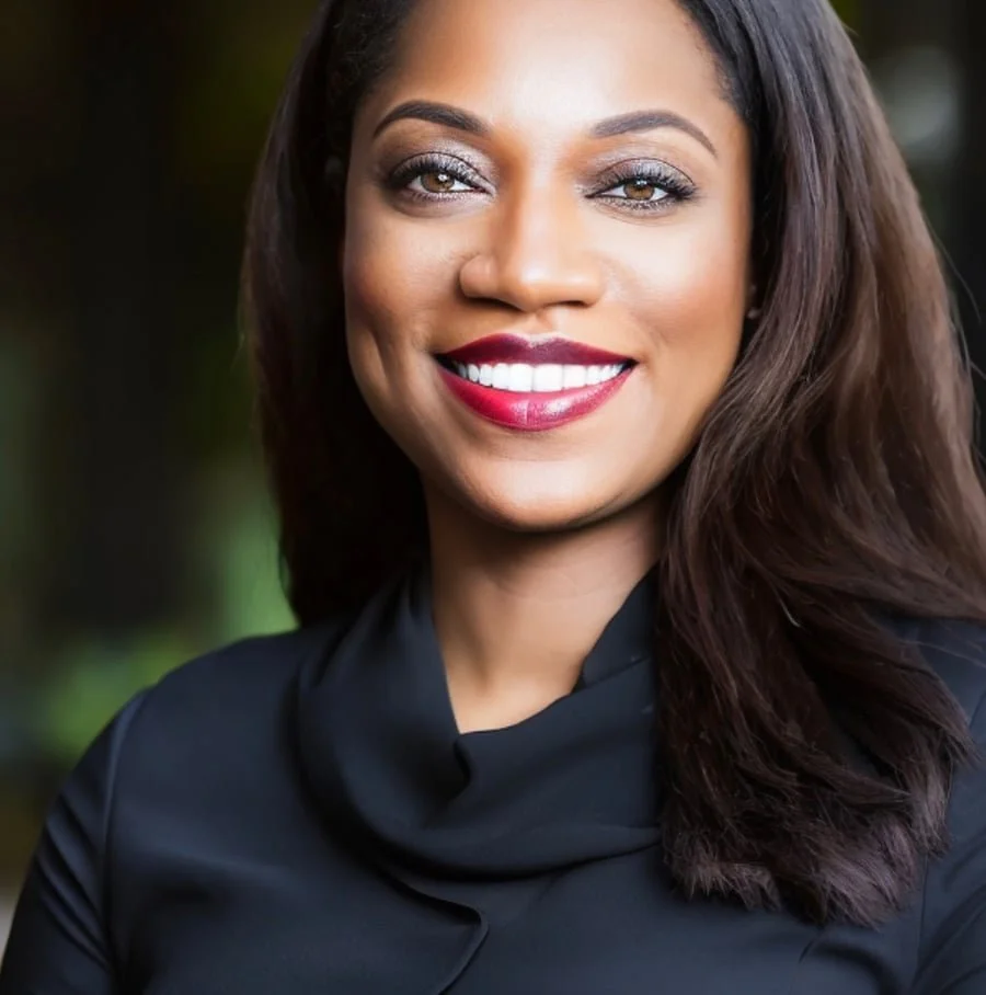 Woamn in a black turtle neck wearing red lipstick