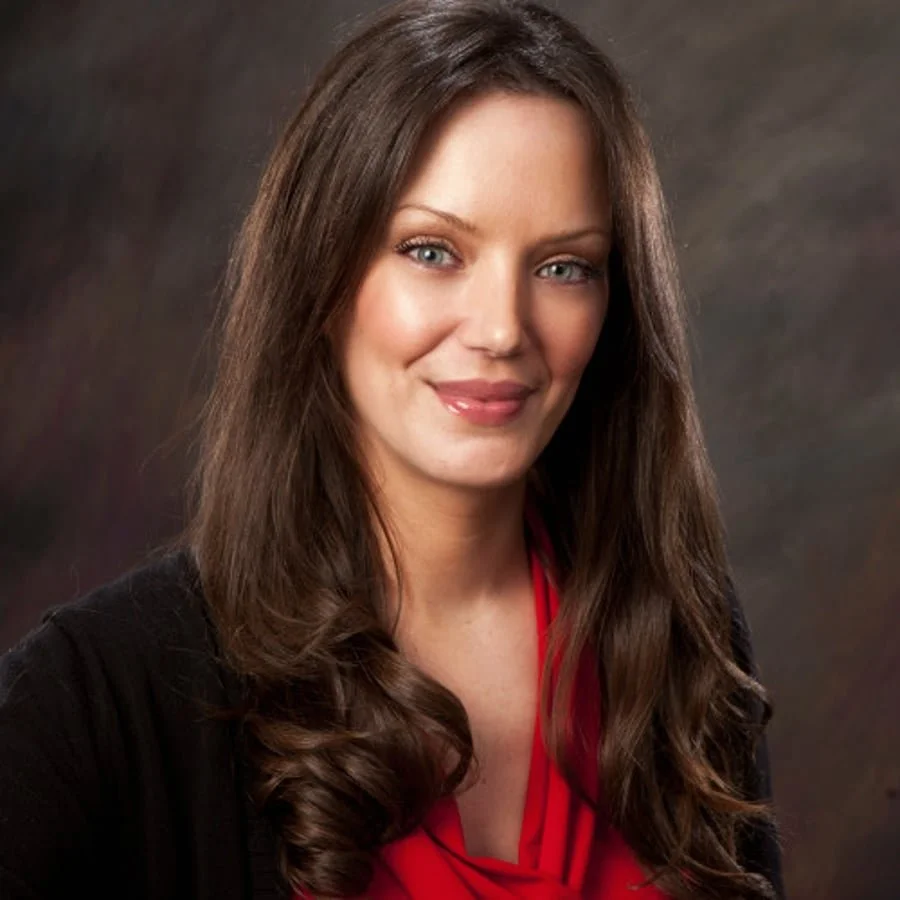 Woman in red shirt and black sweater
