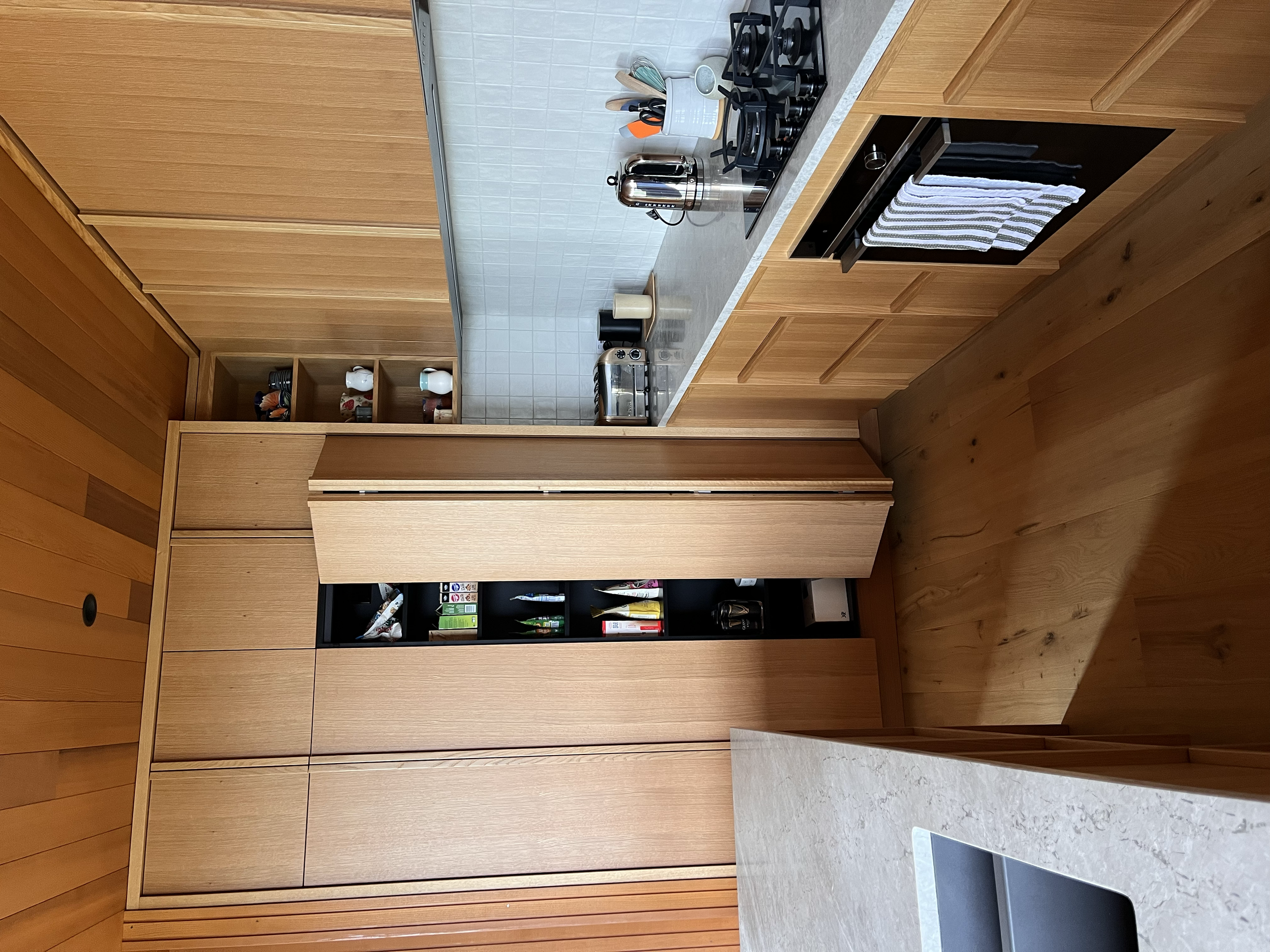 Oak with moulded Oak handles / Kitchen with double bifold pantry / Kūaotunu, 2025