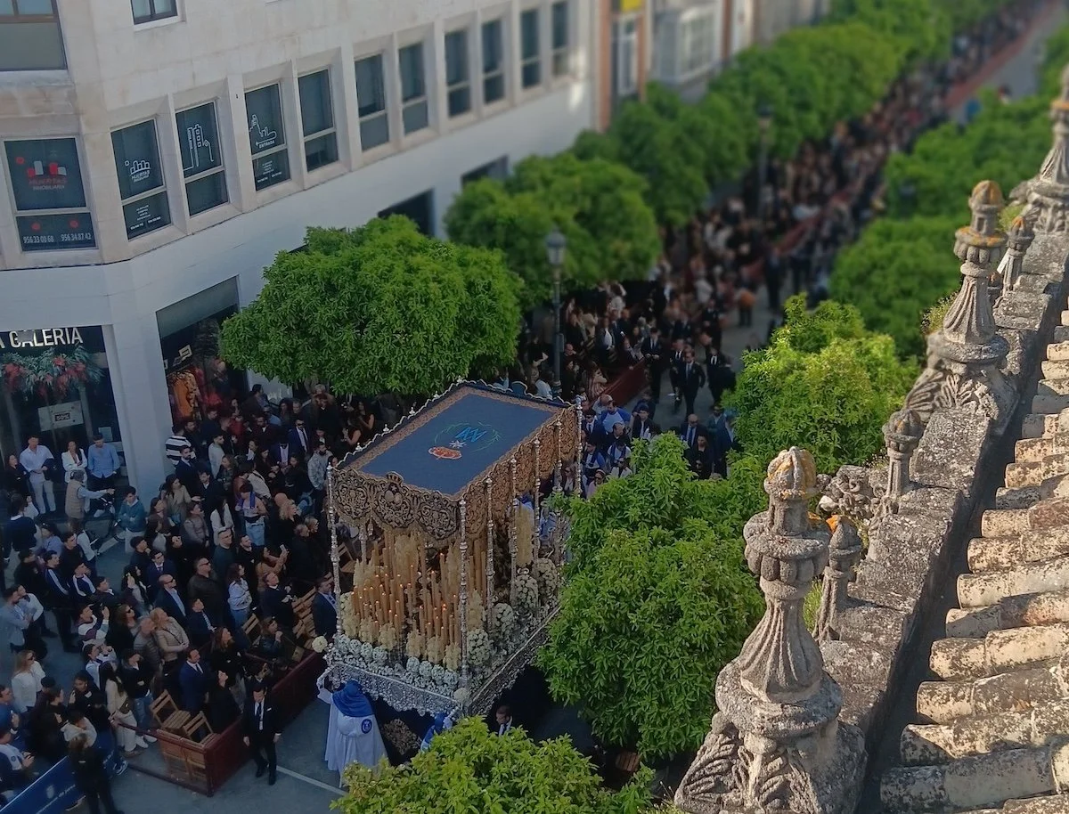 A huge street parade led by a float featuring the Virgin Mary during Semana Santa in Jerez