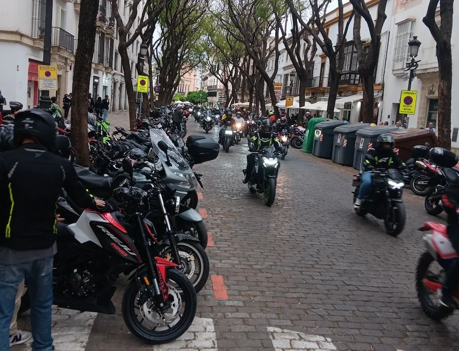 A street crowded with motorcycles