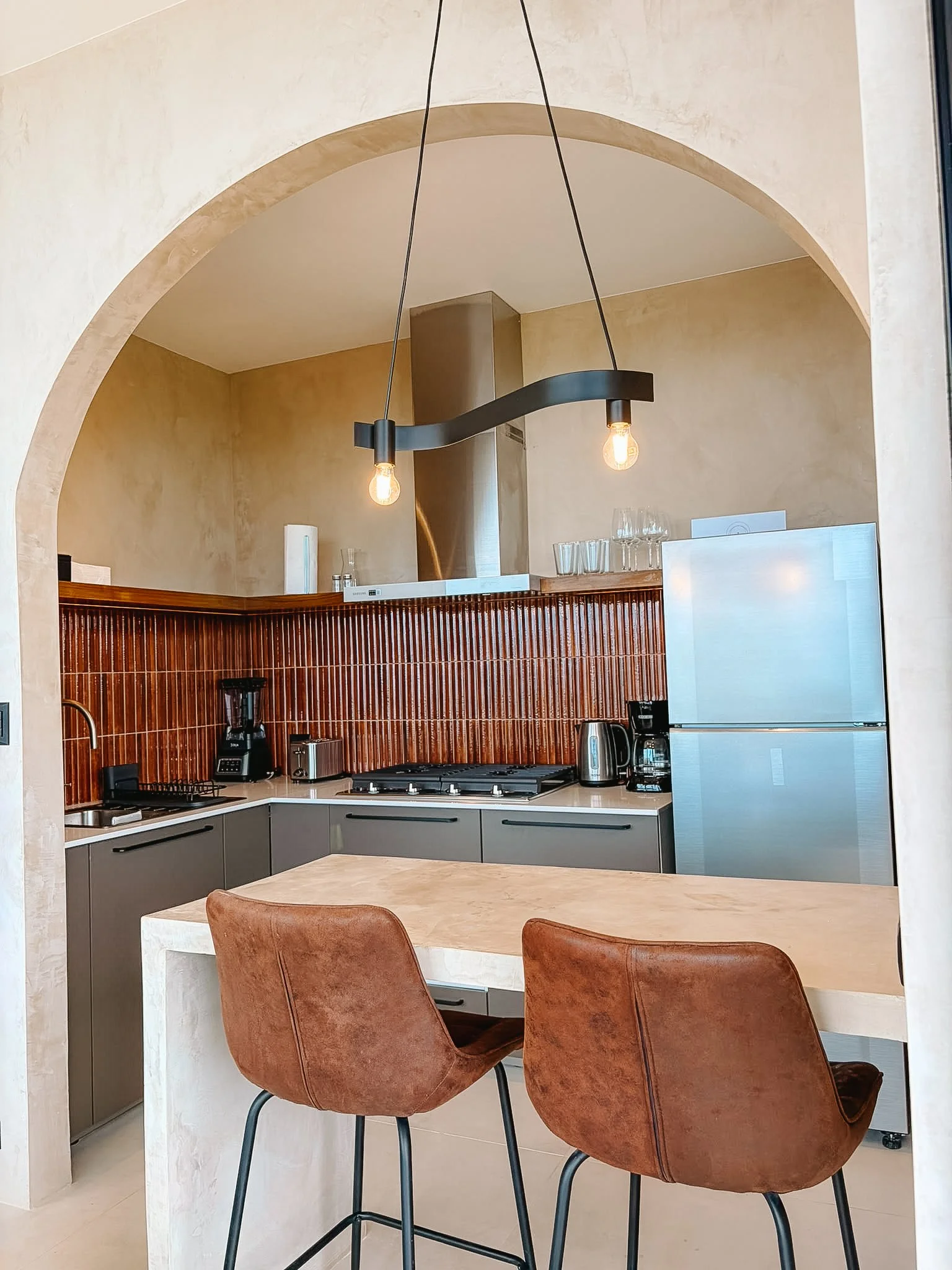 Fully equipped kitchen with bar seating for two.