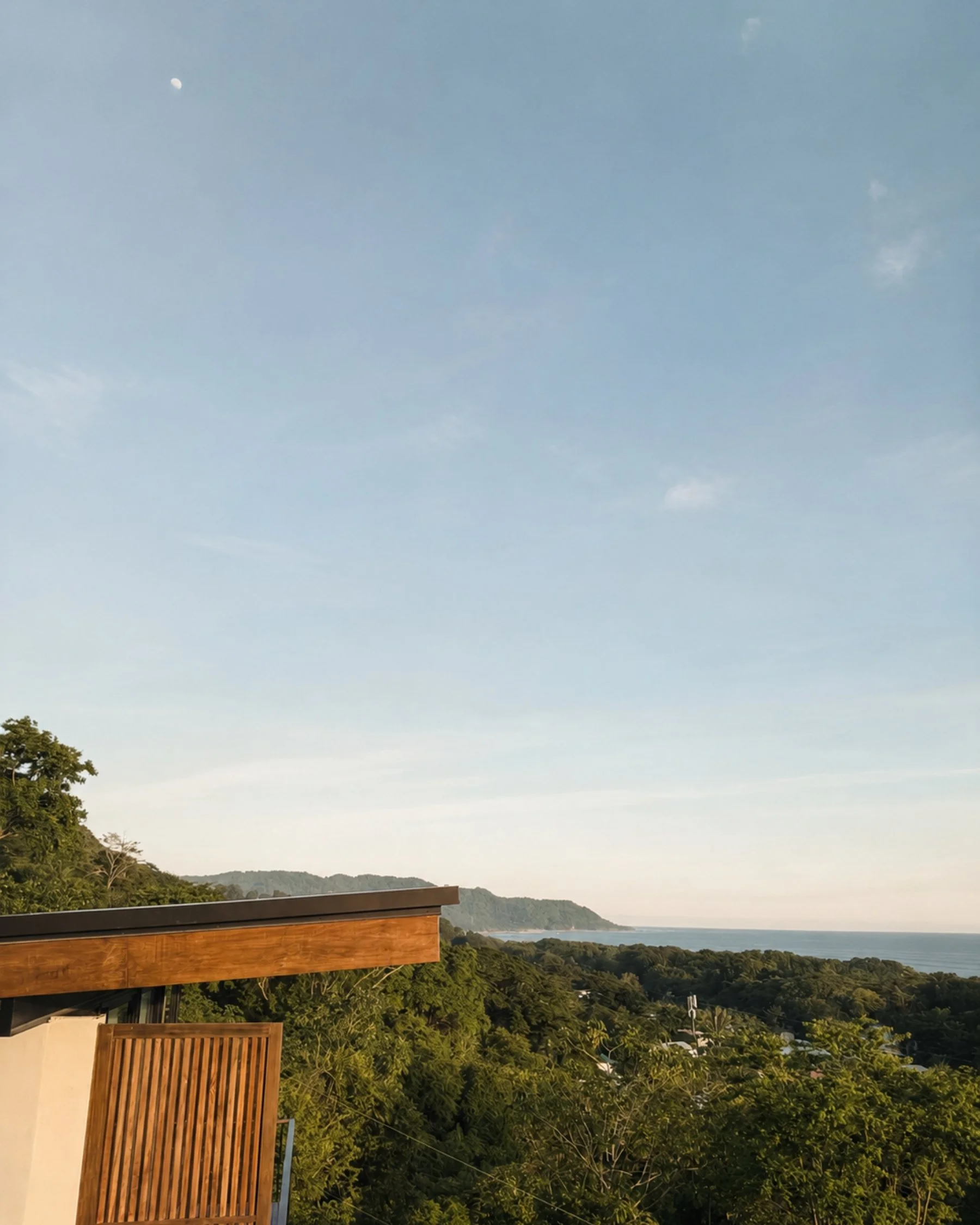 Elevated view across the jungle toward the Pacific Ocean near Santa Teresa.