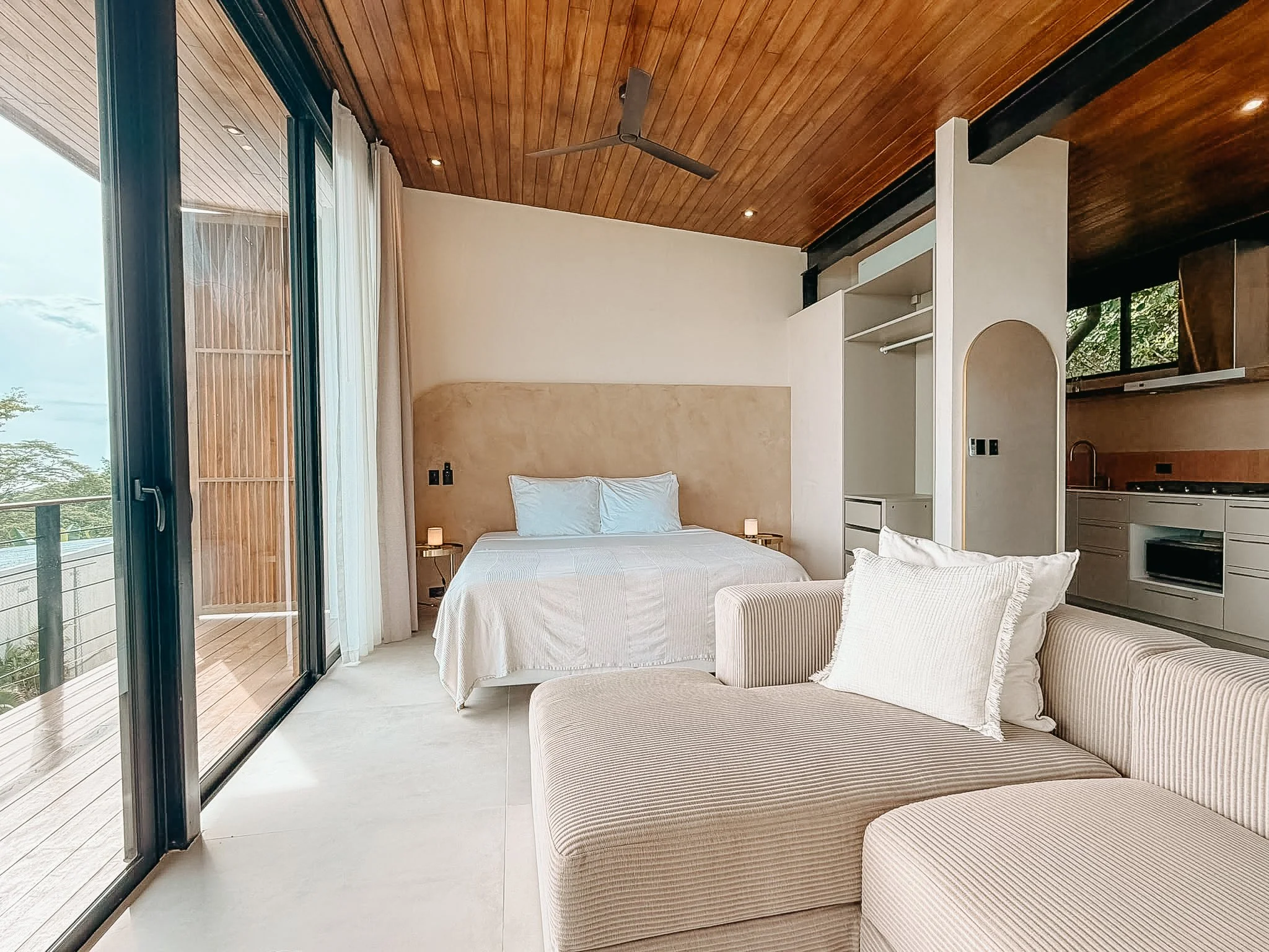 Open-plan Casa Surya studio combining the king-size bed, lounge area and fully equipped kitchen.