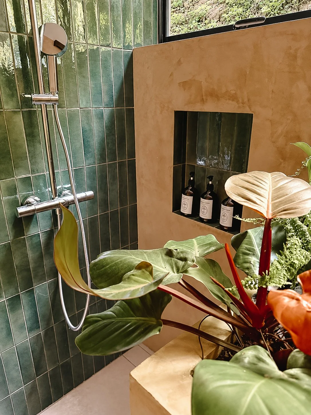 Rainfall shower opening onto the surrounding jungle.