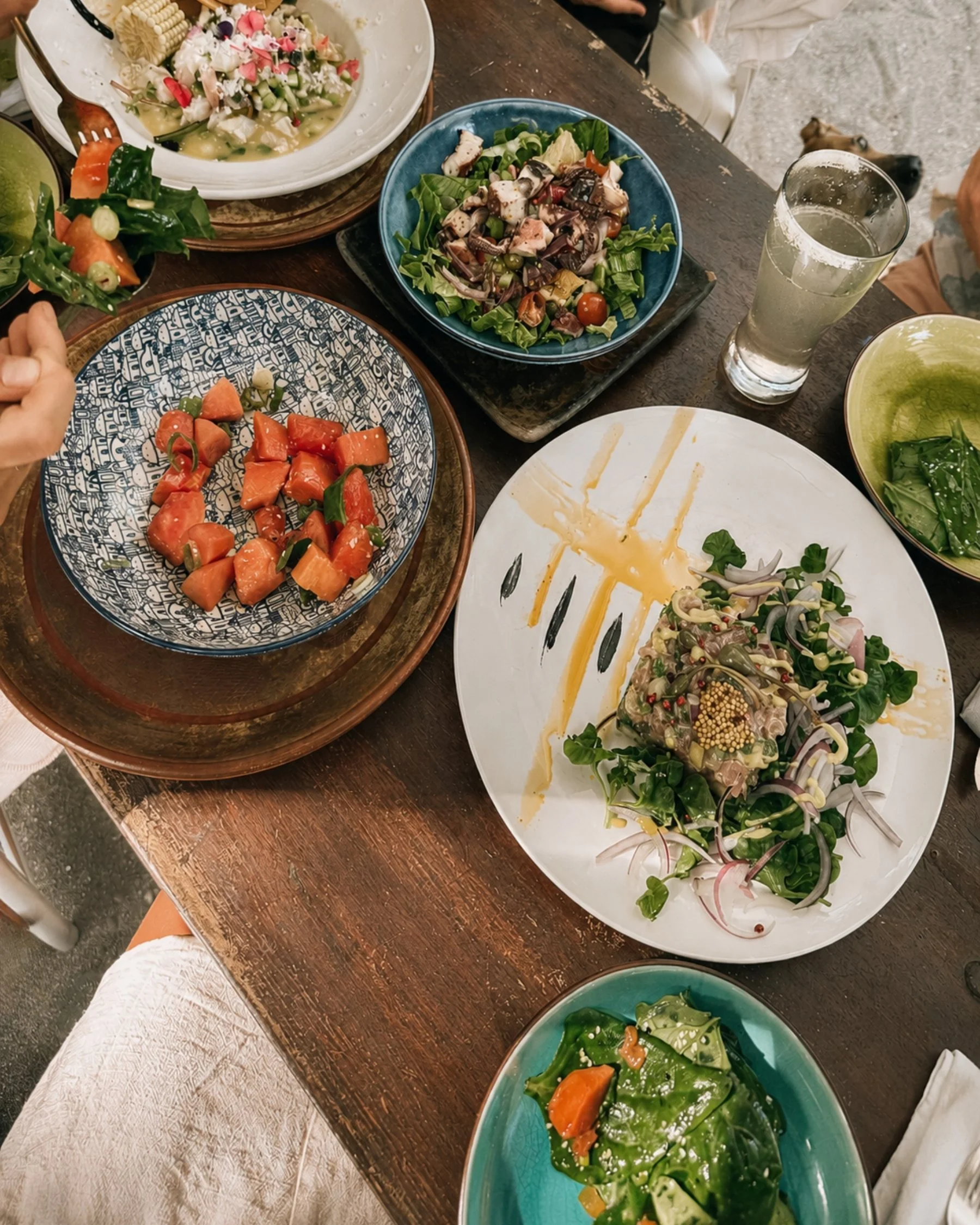 Colorful local dishes shared around a table in Santa Teresa, Costa Rica.