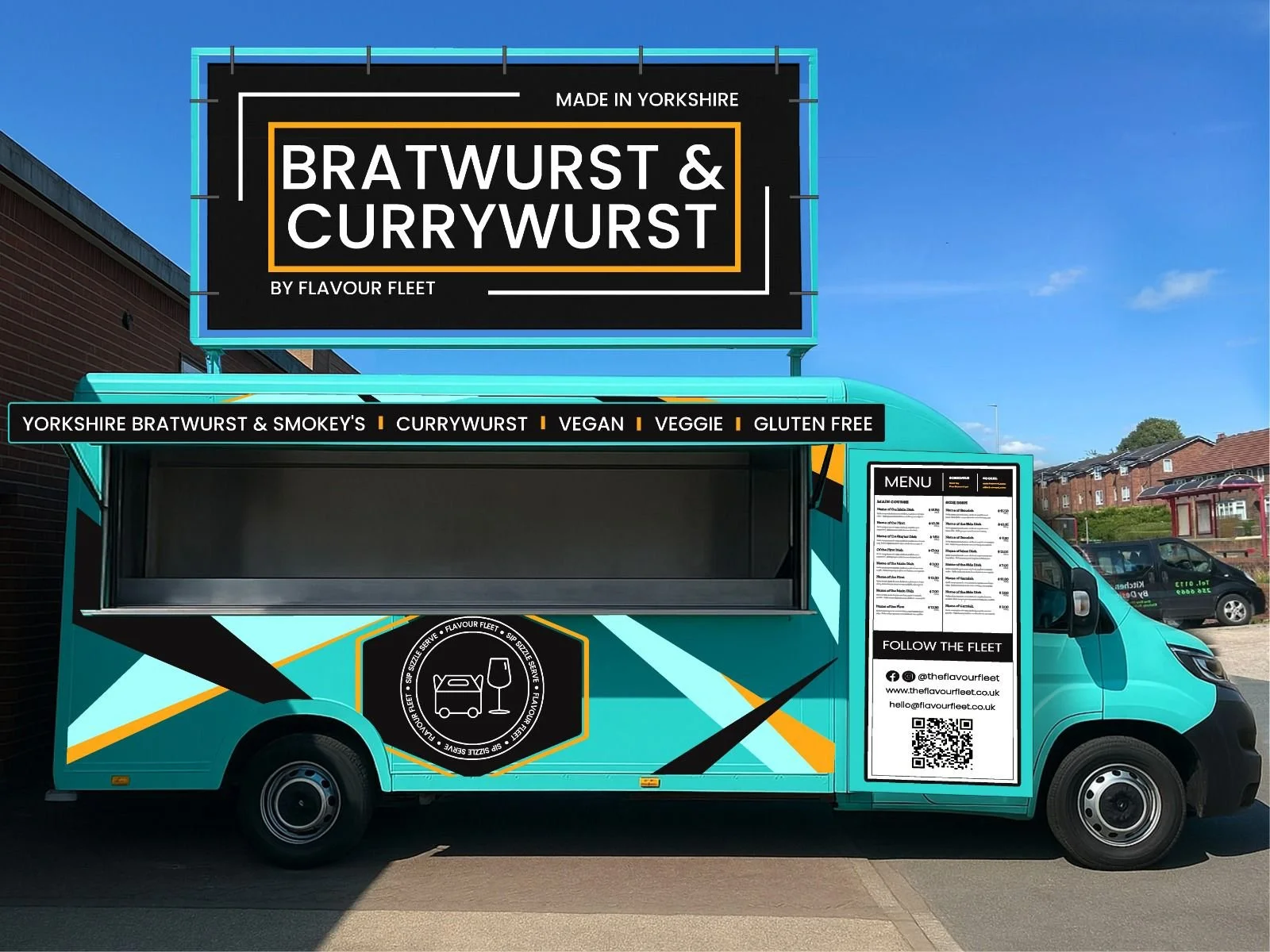 Colorful food truck with a sign advertising bratwurst and currywurst made in Yorkshire, with a menu displayed on the side and social media contact information.