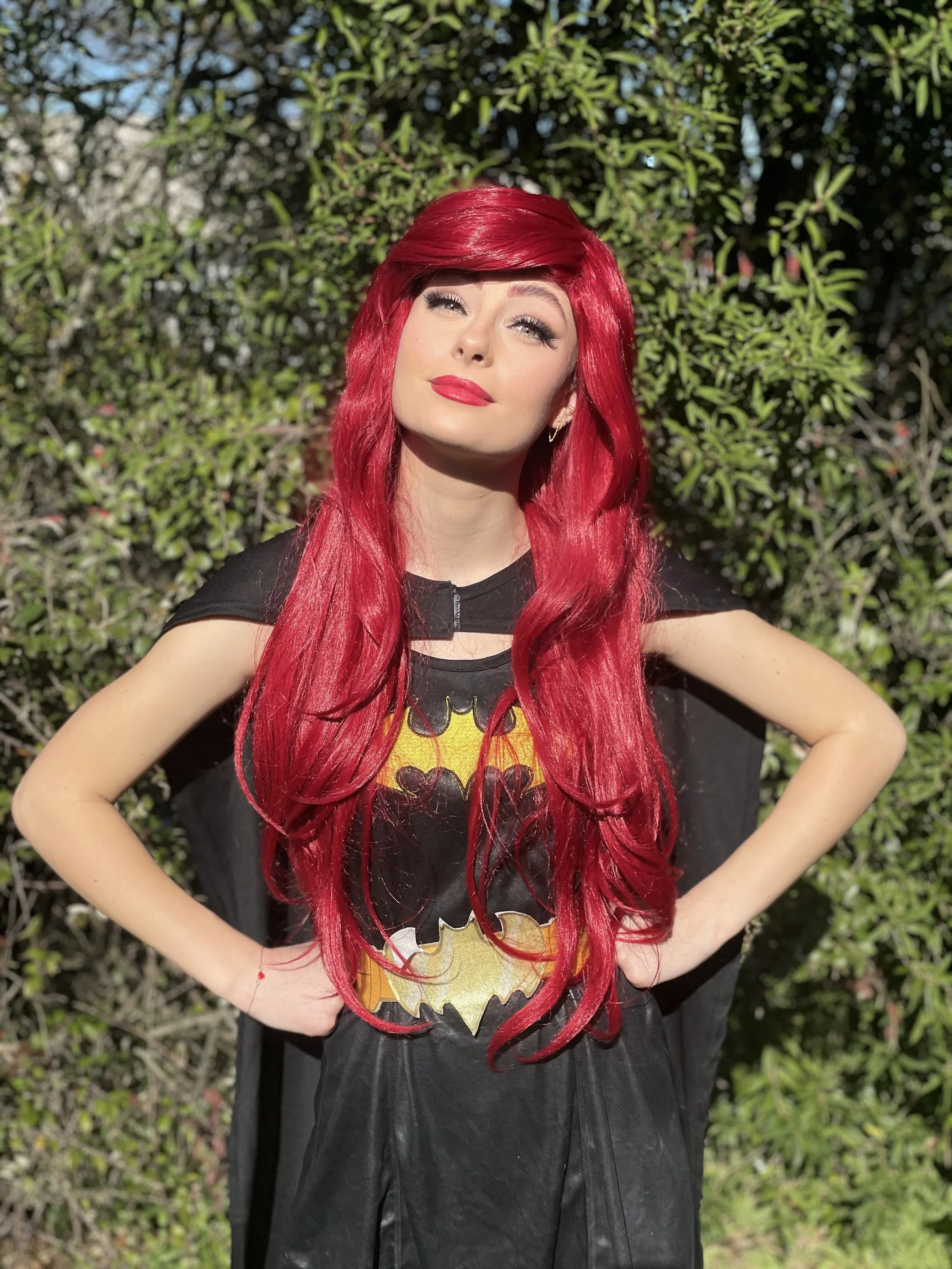 woman dressed as batgirl with red hair