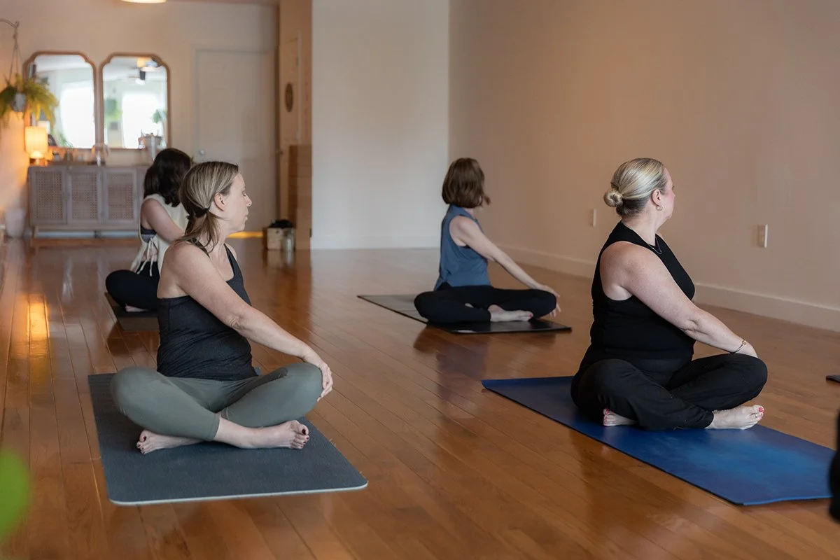 Students practicing a gentle traditional yoga class at Sanctuary Yoga & Wellness in Exeter, NH.