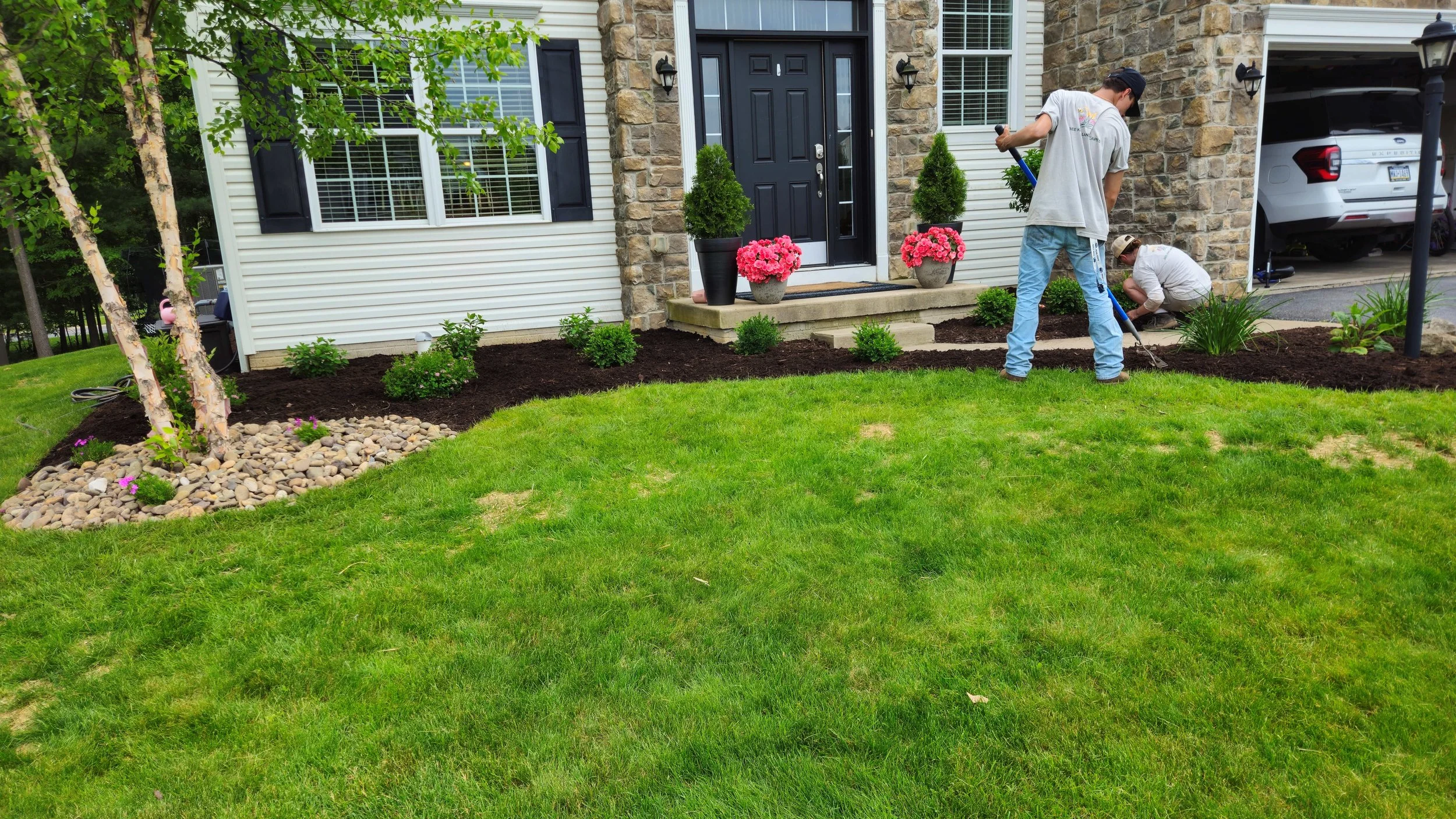 Bee Kind Landscapes crew mulching native garden