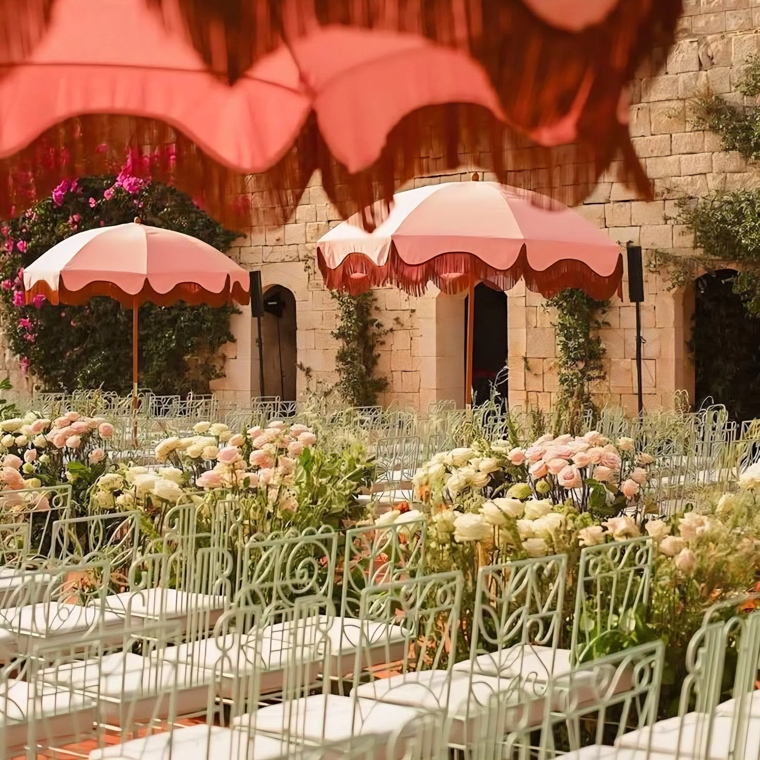 Parasols and flowers Cotswolds wedding