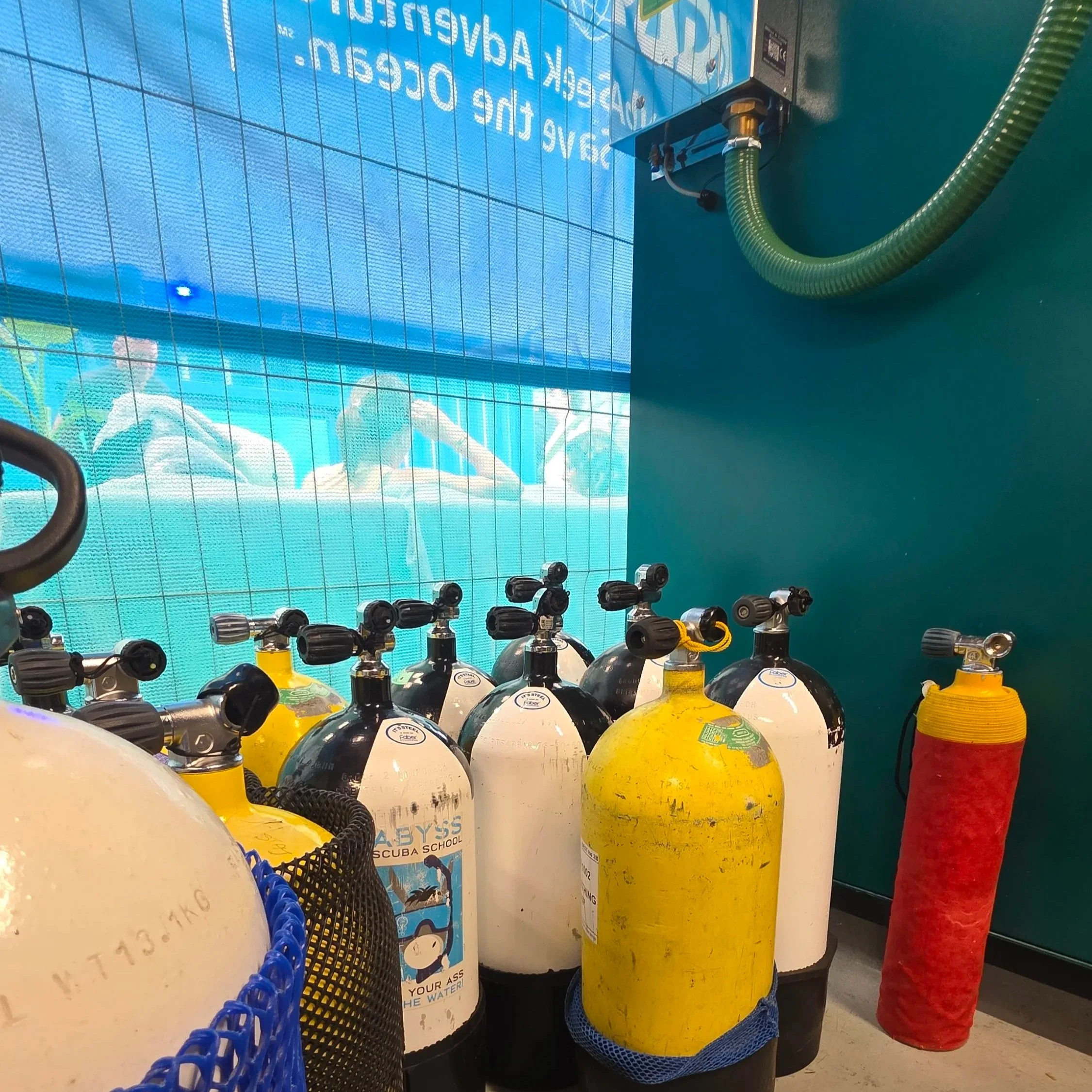 Qualified diver checking the oxygen percentage of a Nitrox cylinder with an analyser