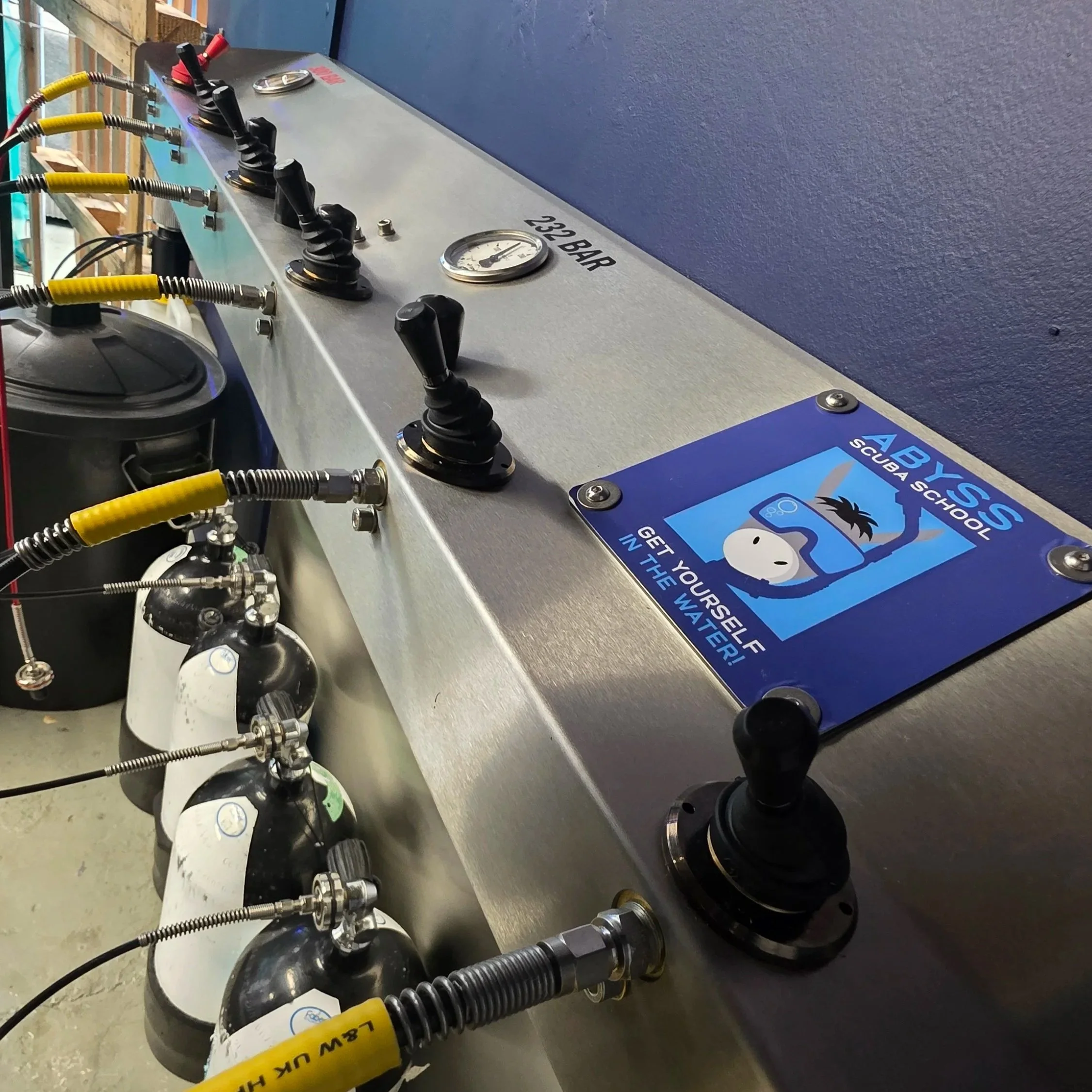 Scuba cylinders prepared for air and enriched-air Nitrox fills