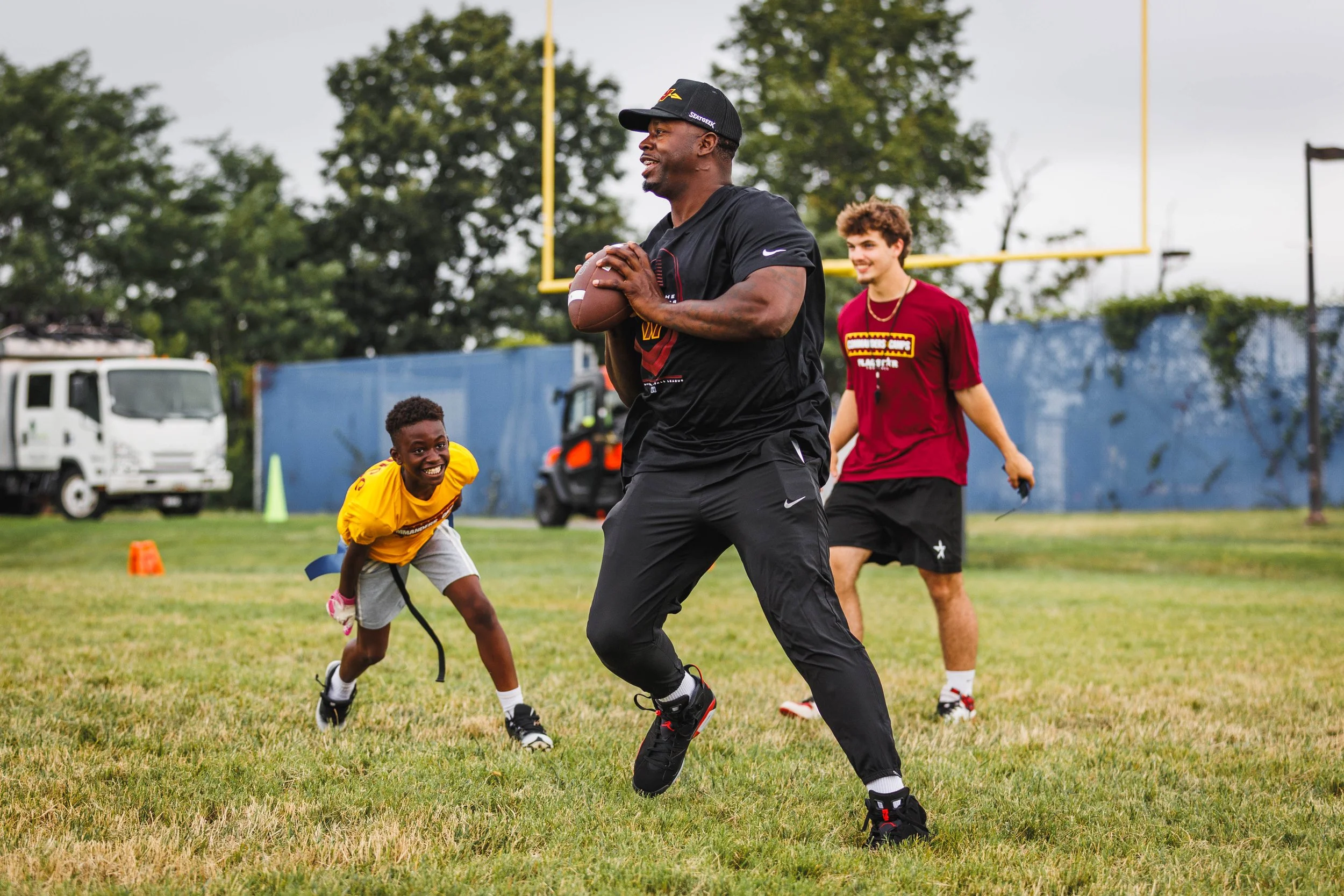 Josh Morgan Playing with Campers in Cap Hill.jpg
