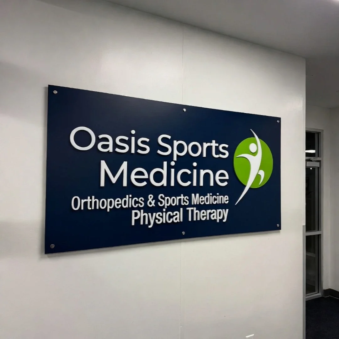 Sign for Oasis Sports Medicine, offering orthopedics, sports medicine, and physical therapy.