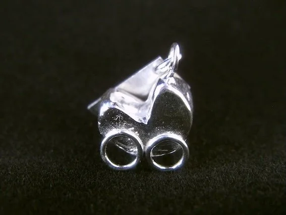 Pram,   On Landguard Point    (2012), silver charm by Victoria Constable
