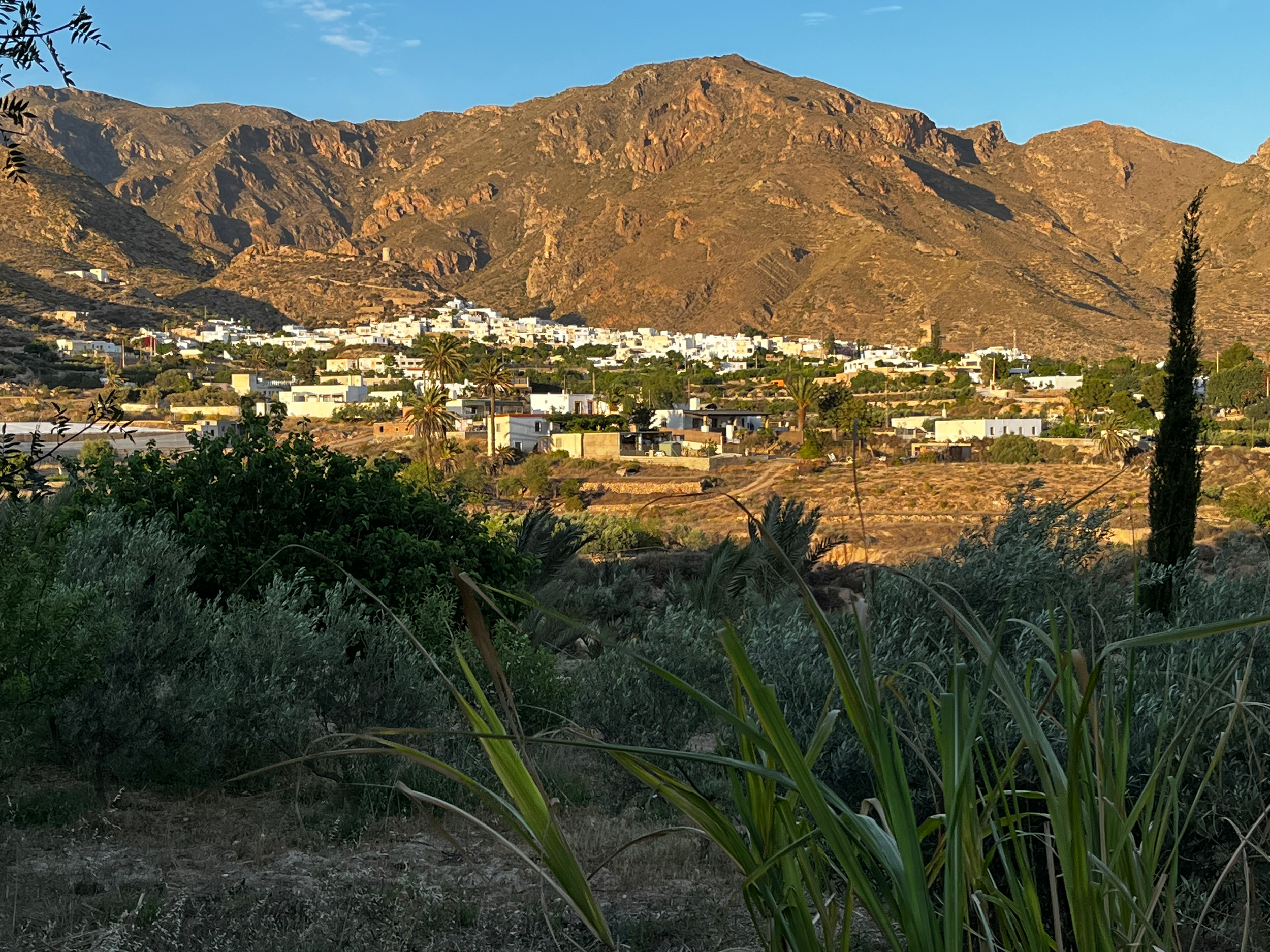 Scenic view of the village of Níjar with the mountains rising behind, showcasing the peaceful rural setting of the retreat.