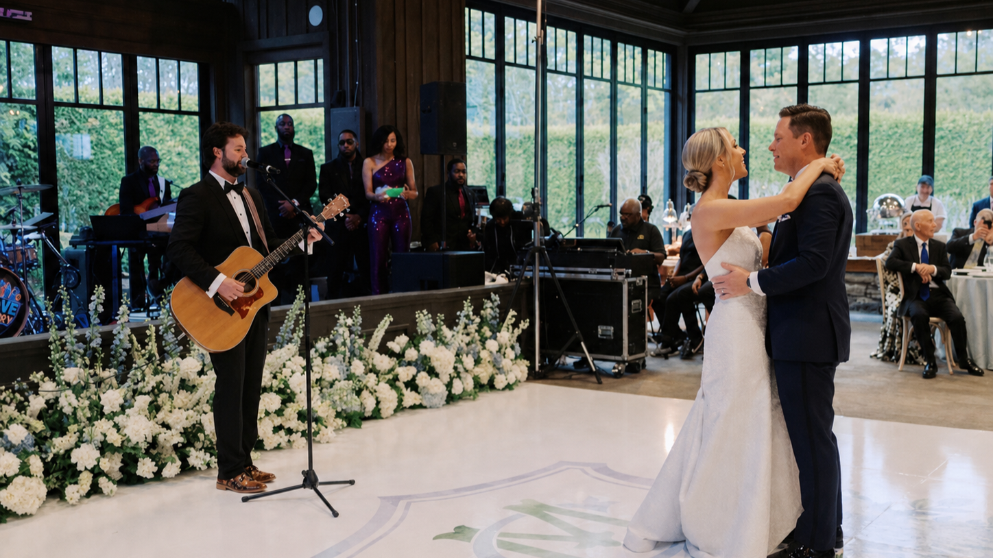 Wedding ceremony with bride and groom walking down the aisle, guests and bridesmaids in the background.