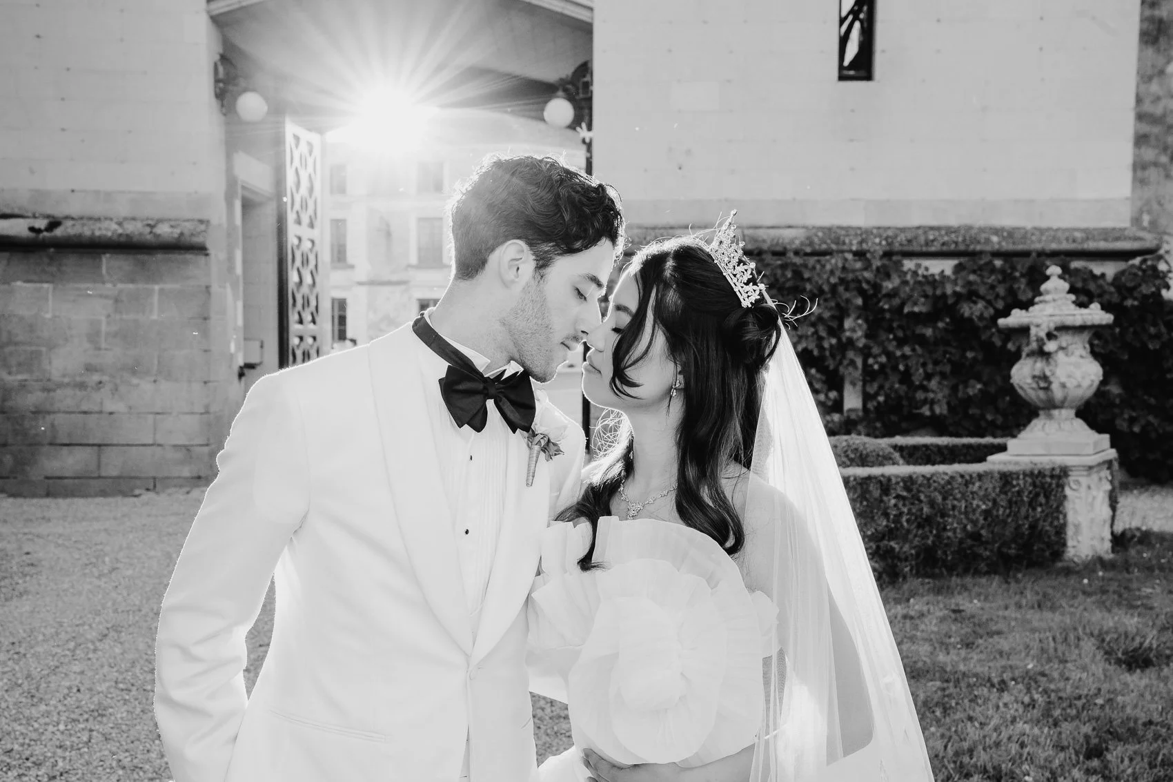 Bride and groom at sunset in black and white at chateau challain