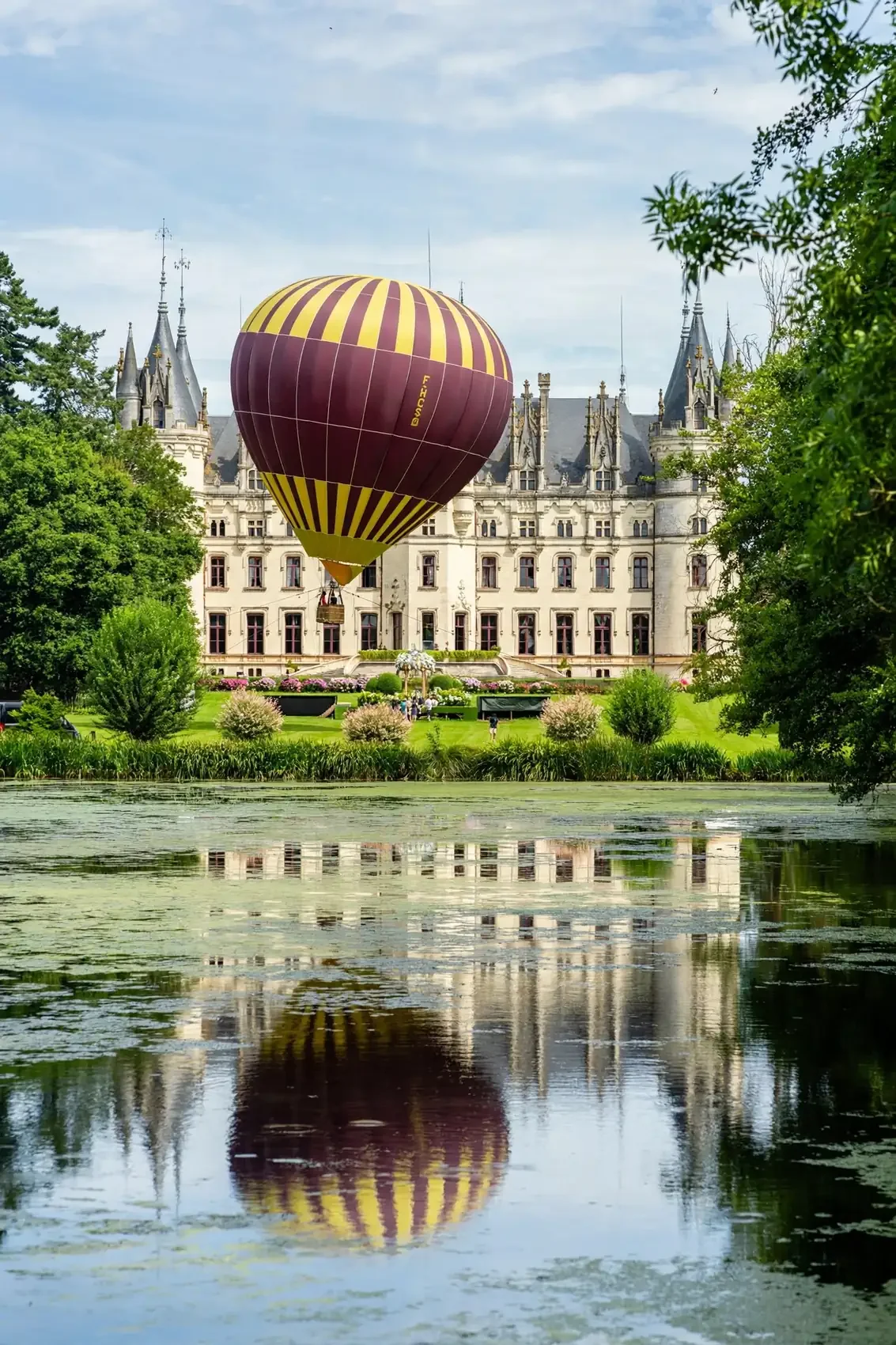 hot air balloon with lake chateau challain - by Flavio Bandiera