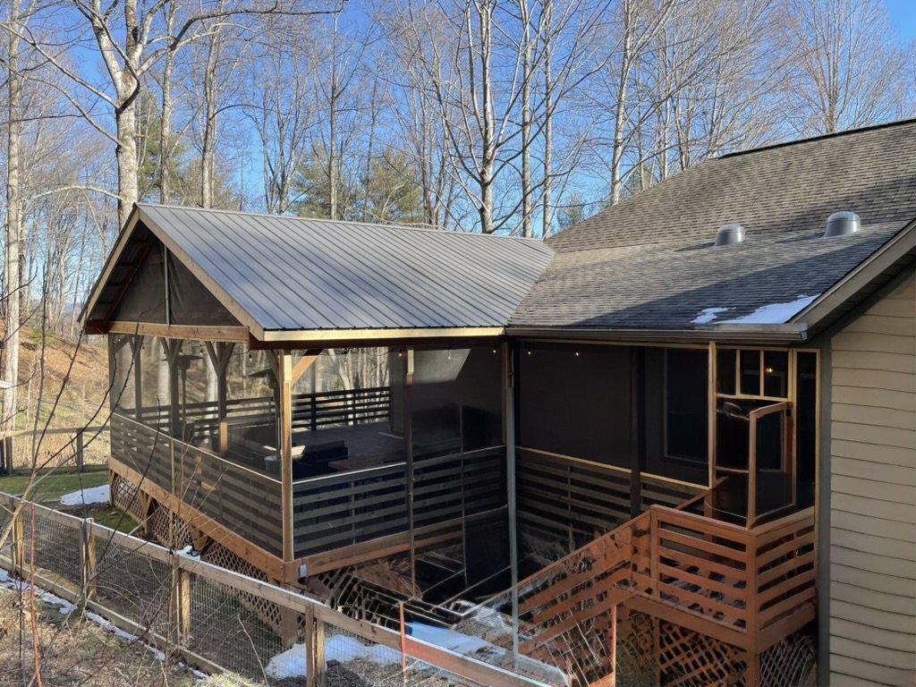 Spacious screened-in deck seamlessly integrated into a Western North Carolina home