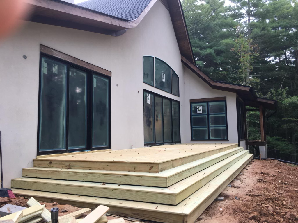 “Handcrafted wooden deck and porch built for outdoor living in Waynesville, NC by Quality Carpentry Waynesville.”