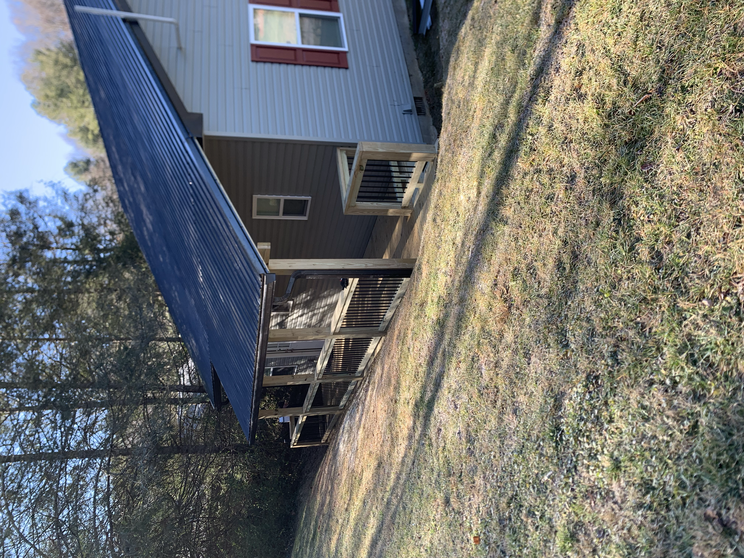 “Handcrafted wooden deck and porch built for outdoor living in Waynesville, NC by Quality Carpentry Waynesville.”