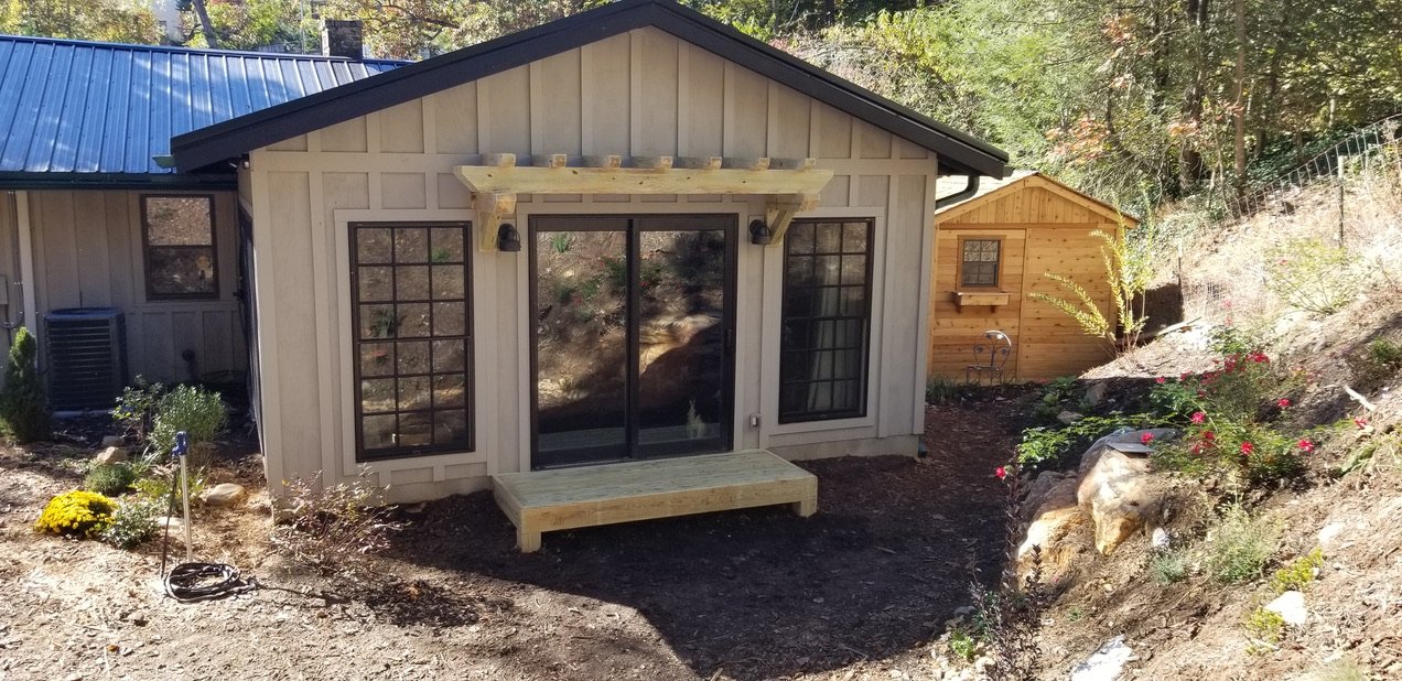 “Handcrafted wooden deck and porch built for outdoor living in Waynesville, NC by Quality Carpentry Waynesville.”