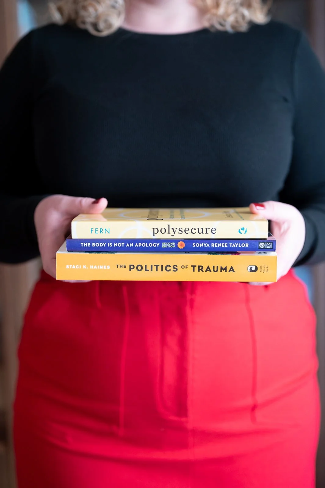 Therapy books including Polysecure, The Politics of Trauma, and more