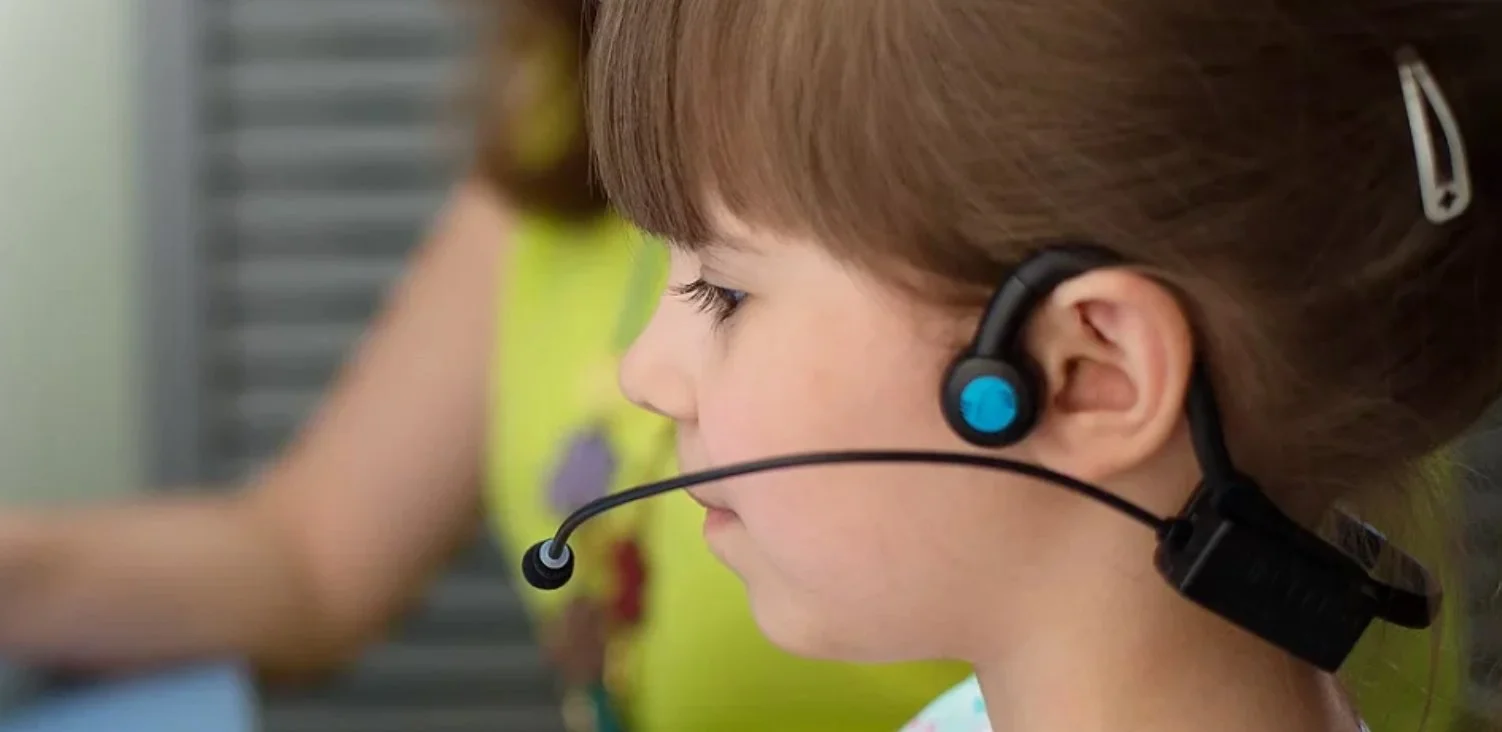 Little girl wearing Forbrain headset