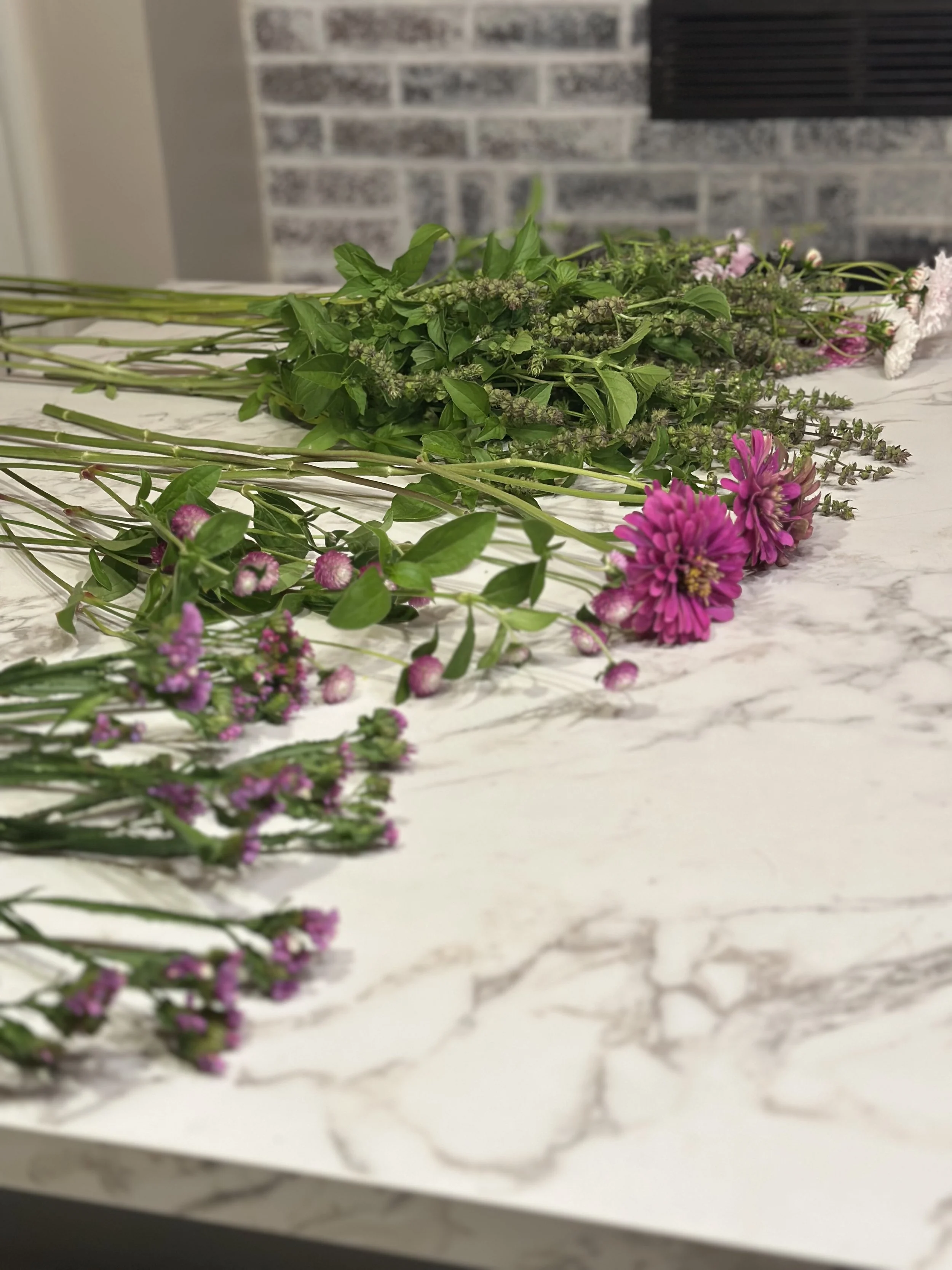purple flowers on marble countertop