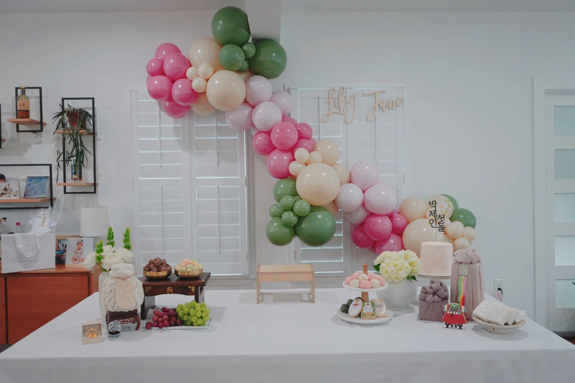 Custom 9 foot organic garland in cream, sage green, blush, and rose pink.