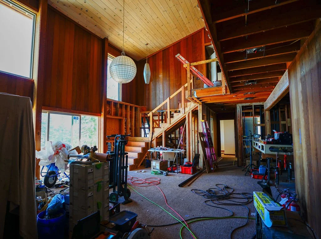 stairs leading to loft in large room under construction
