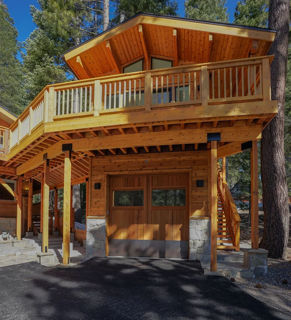 single door garage with adu unit upstairs with railing