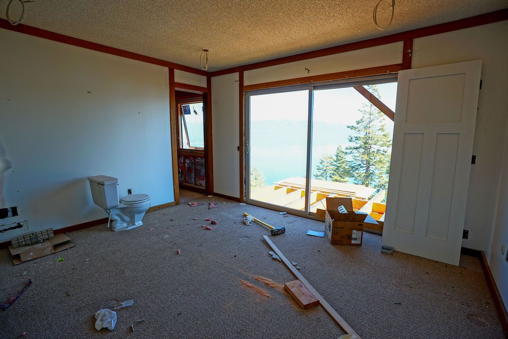 room under construction with new deck and view of lake