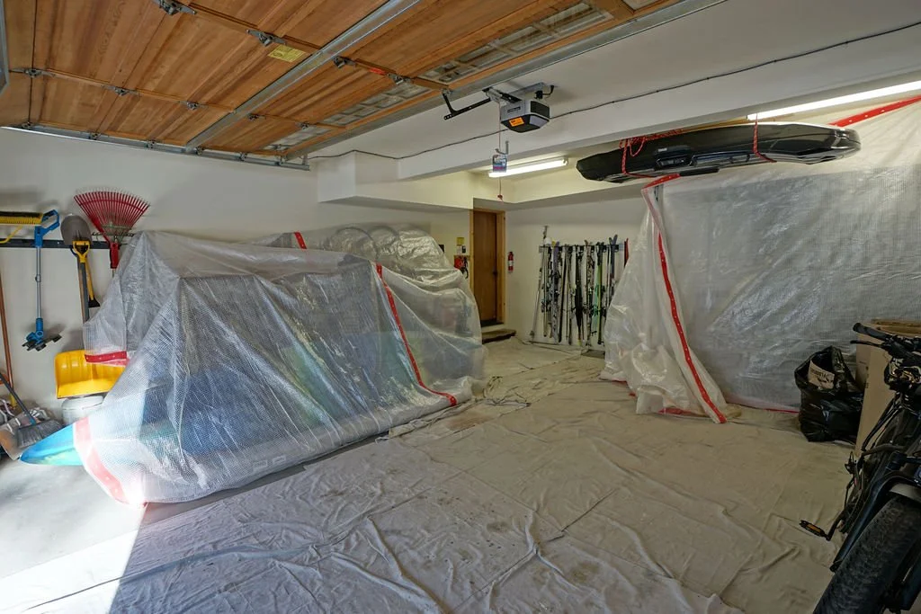 floor and items covered for protection in garage